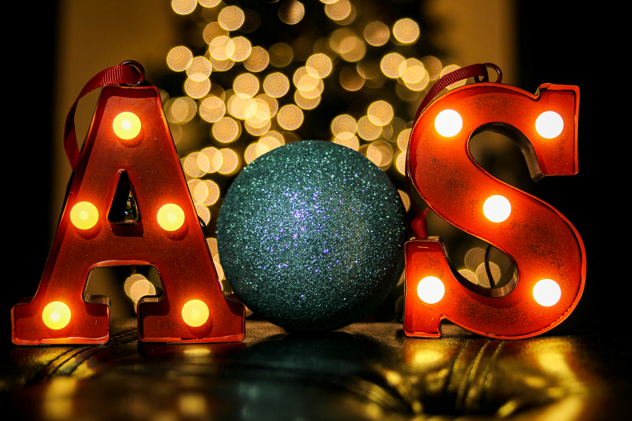 Canon EF 28-80mm f/2.8-4L sample photo. Shot of glowing letters in front of the christmas tree photography