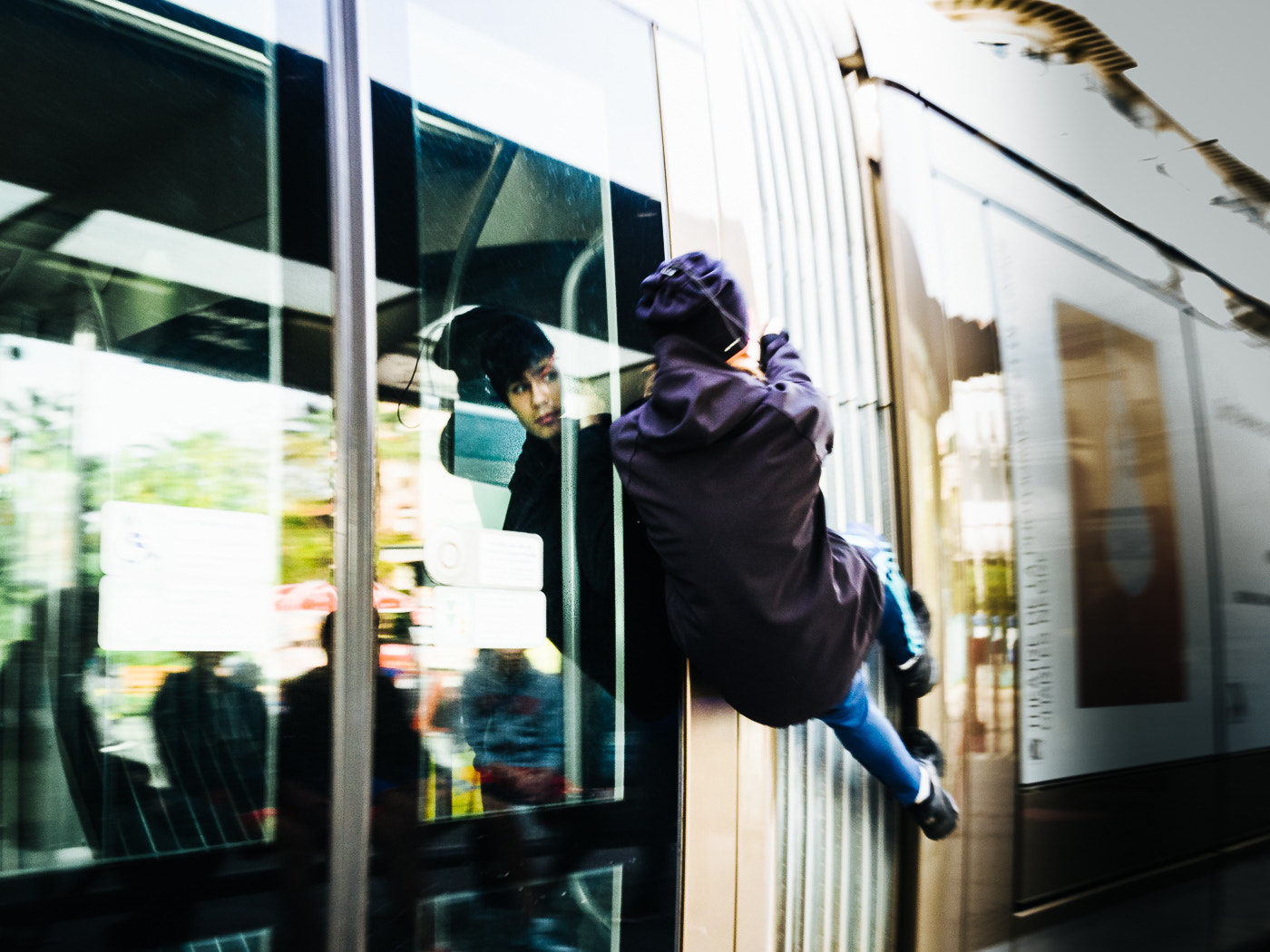 Olympus OM-D E-M10 II + LUMIX G 20/F1.7 II sample photo. Young kid hold on the tram photography