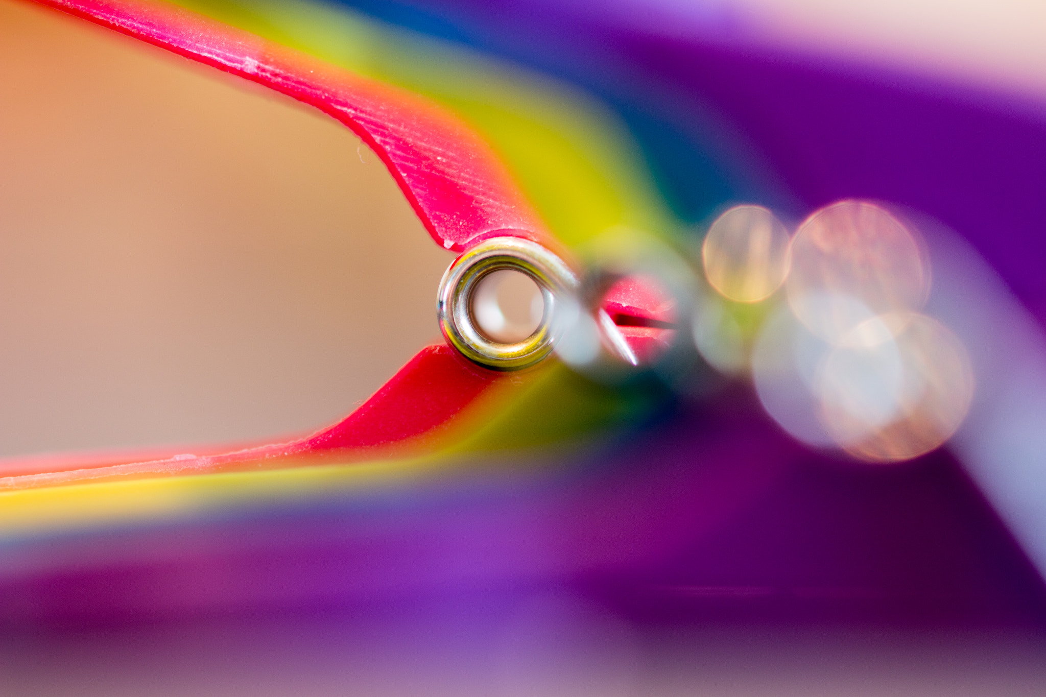 Sigma 105mm F2.8 EX DG OS HSM sample photo. A shot of a line of plastic clothes pegs using a macro lens photography