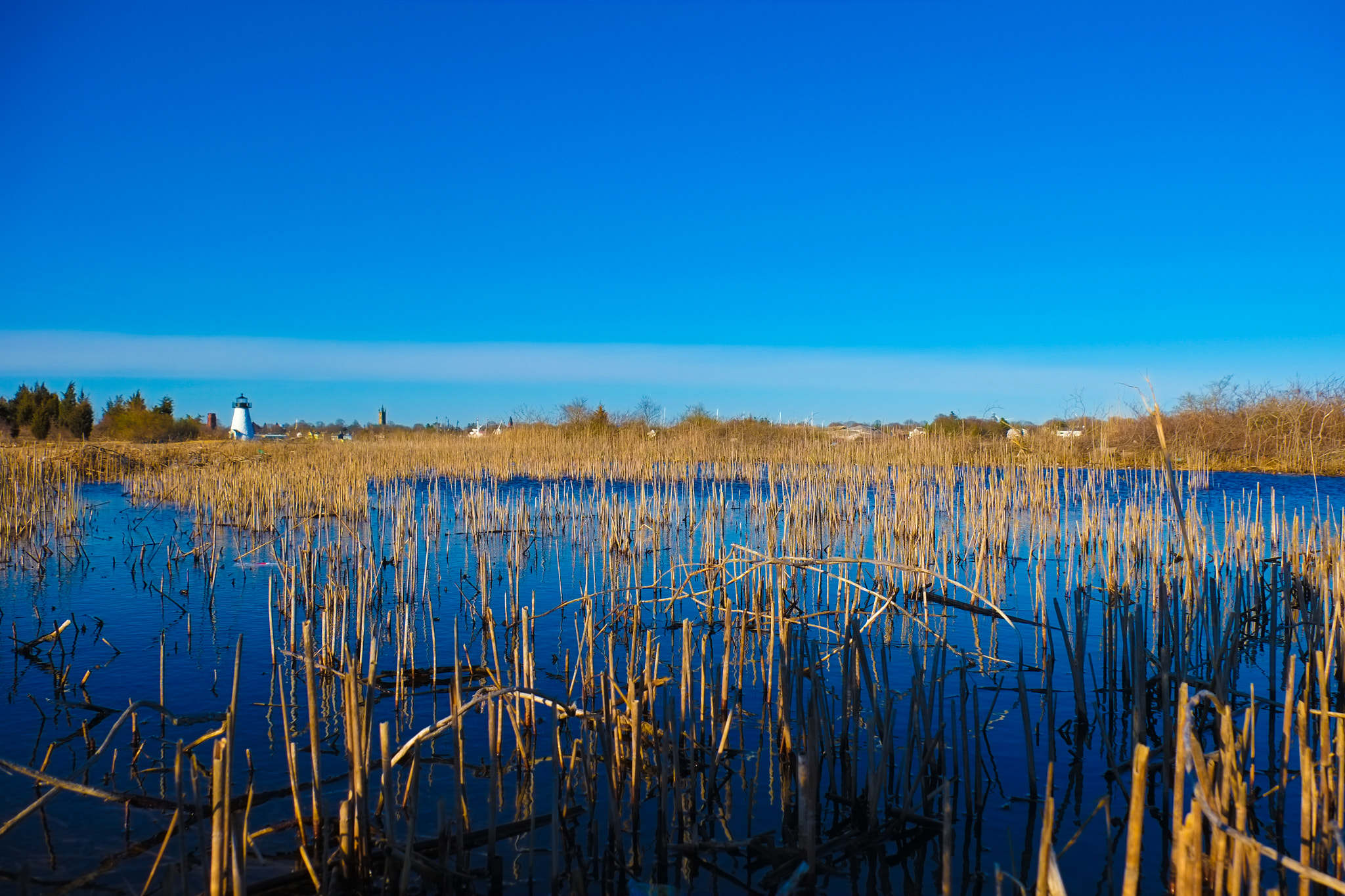 Fujifilm X-E1 + Fujifilm XF 18-135mm F3.5-5.6 R LM OIS WR sample photo. Lighthouse by the pond photography