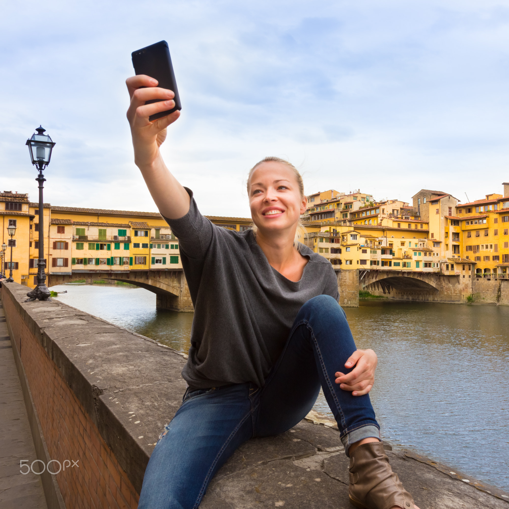 Lady taking selfie in Florence.