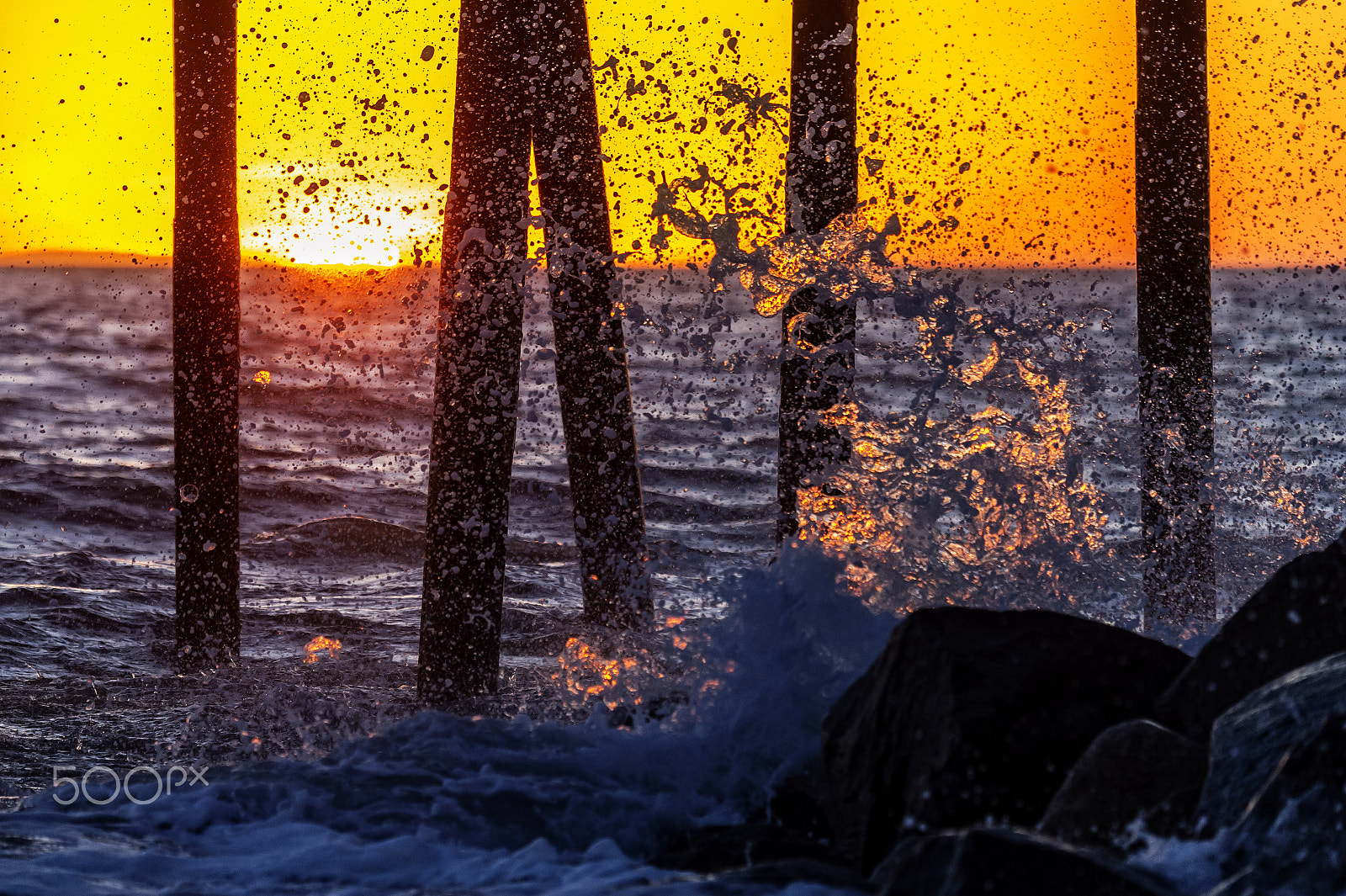 Nikon D3S sample photo. Waves crashing on the pier at sunset photography