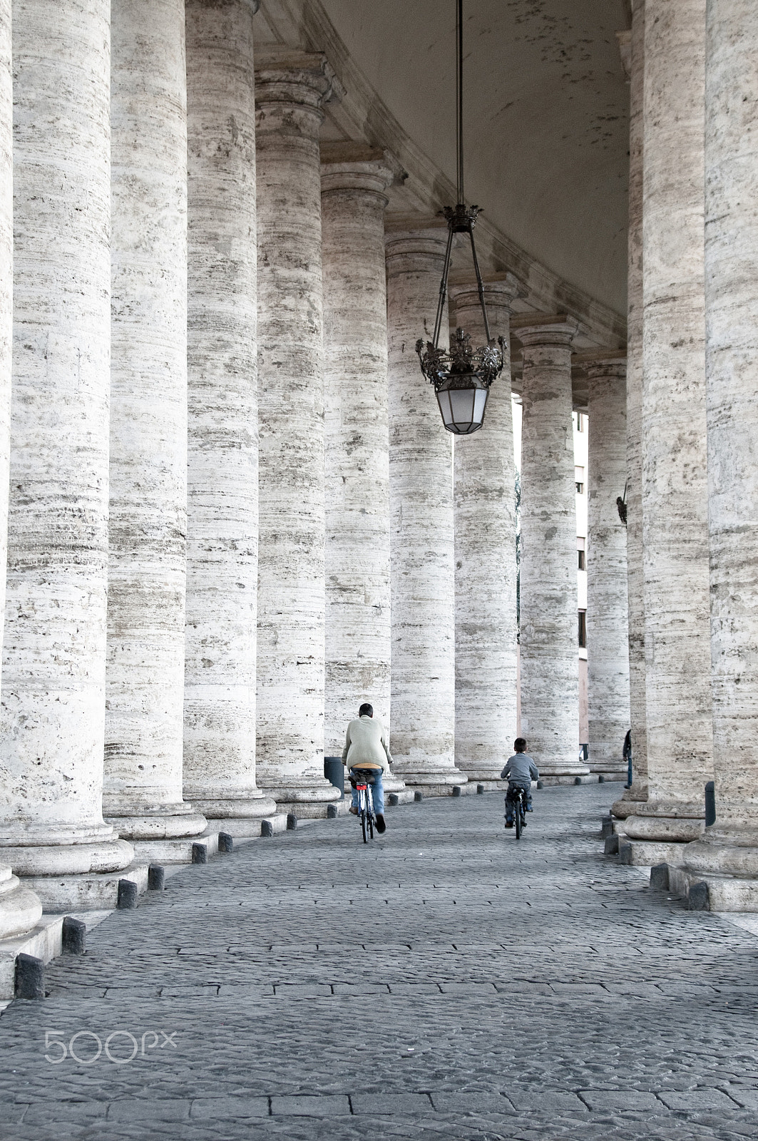 Nikon D300 + Sigma 20-40mm F2.8 sample photo. Father and son biking in san pietro. rome photography