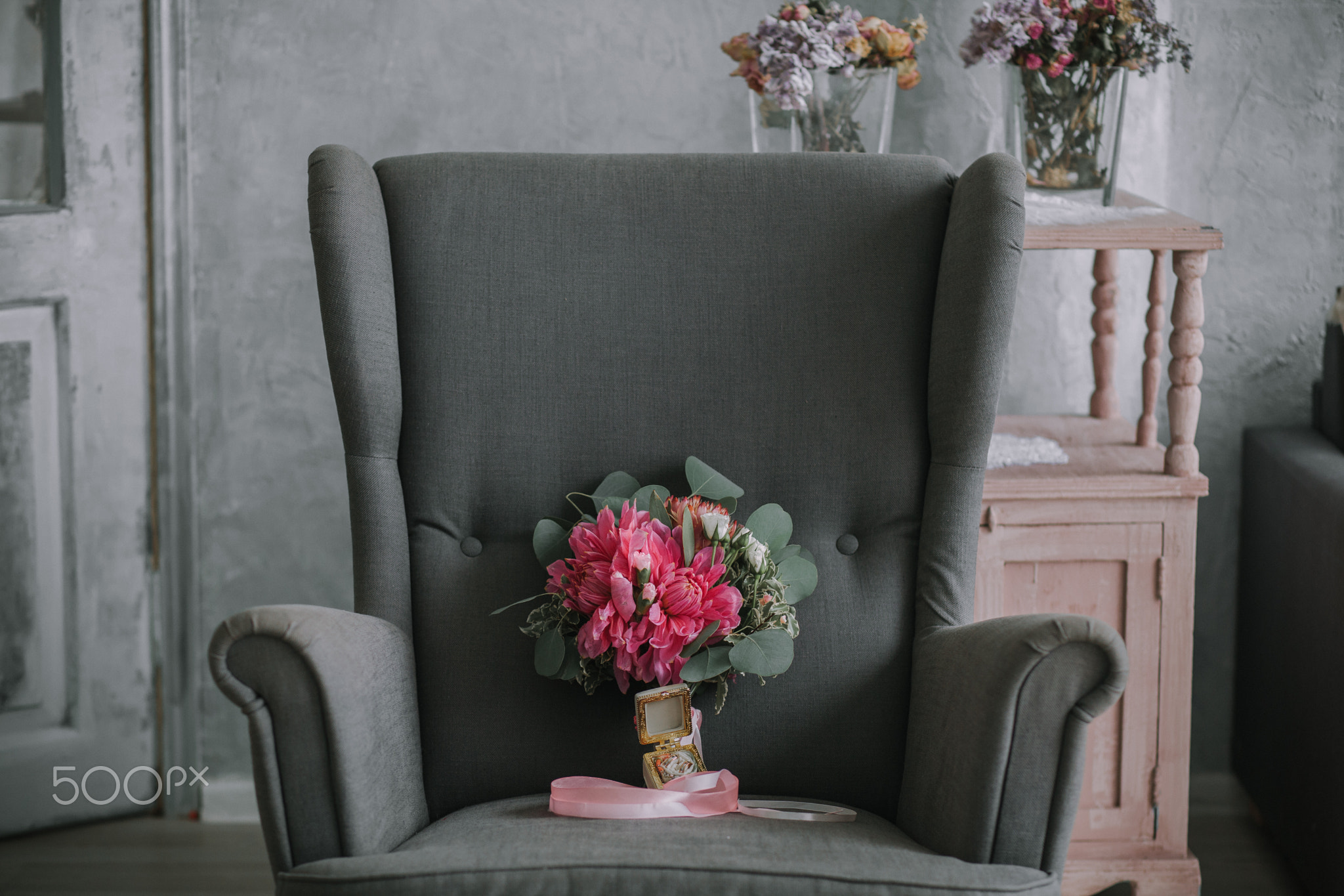 The bride's bouquet in the interior of the room on