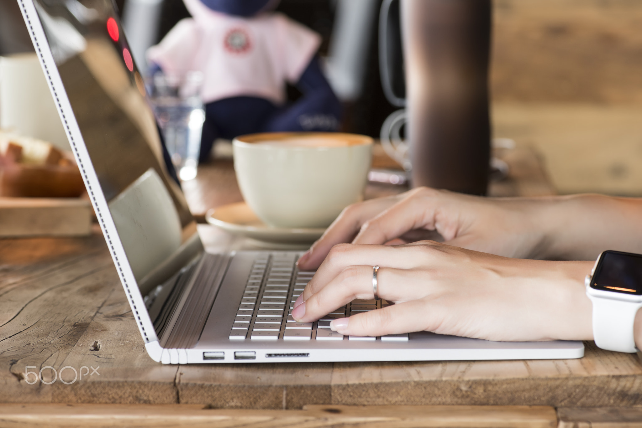 Woman hands typing on laptop