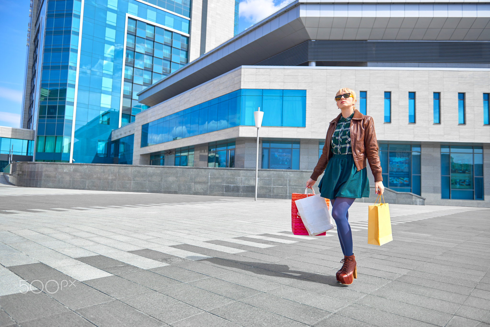 Beautiful woman walking with shopping bags