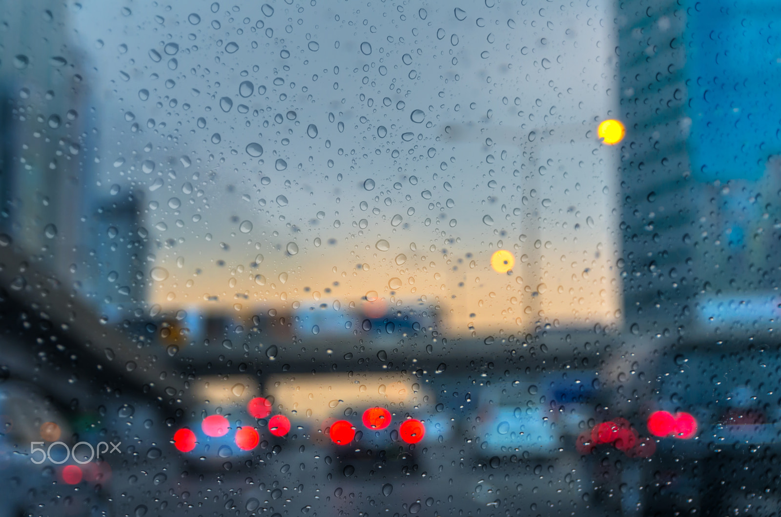 Sigma 17-70mm F2.8-4 DC Macro HSM Contemporary sample photo. Rain drop on the car glass background with sky train. photo blur photography