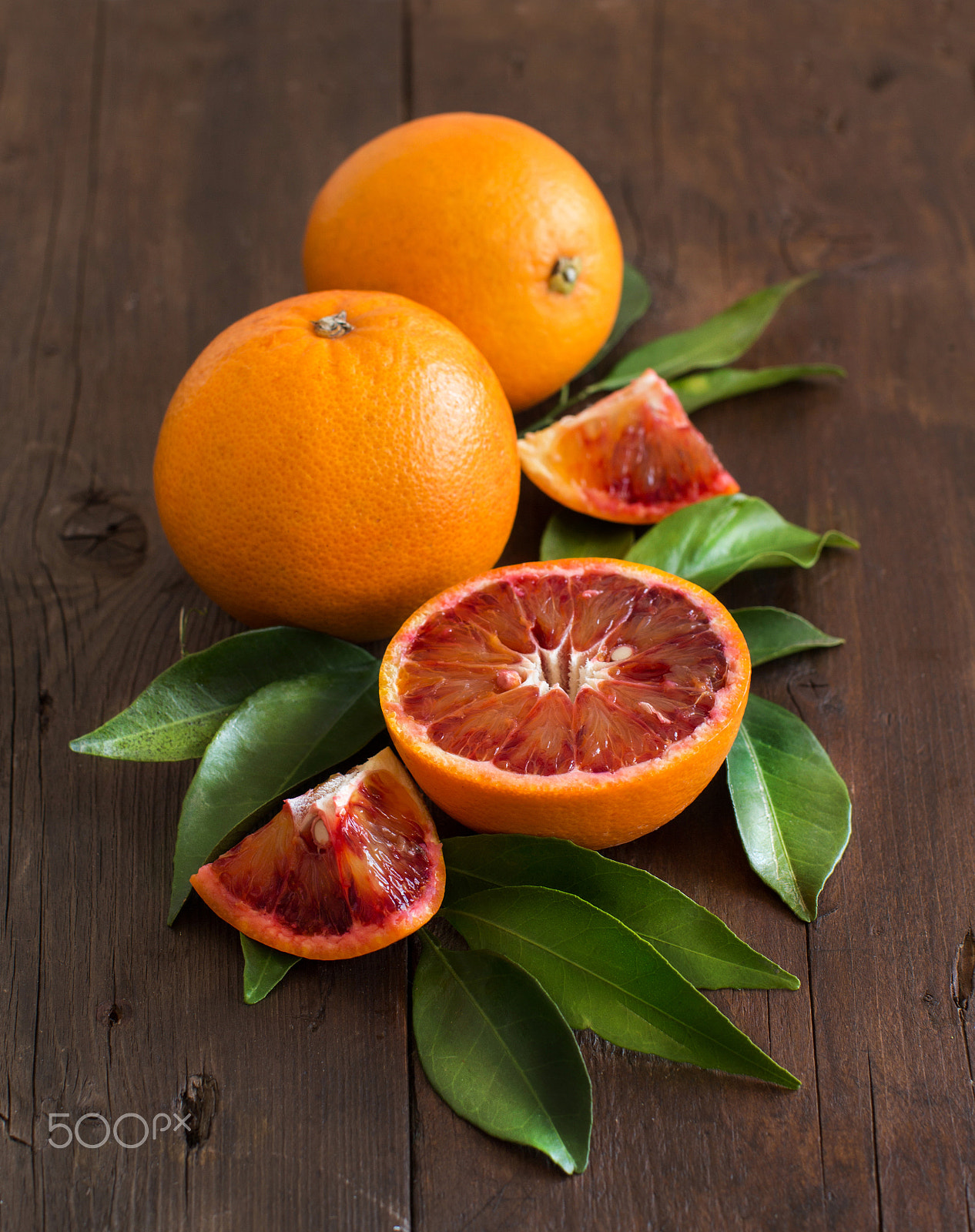 Canon EOS 650D (EOS Rebel T4i / EOS Kiss X6i) + Canon EF 50mm F1.2L USM sample photo. Fresh sicilian oranges with leaves photography
