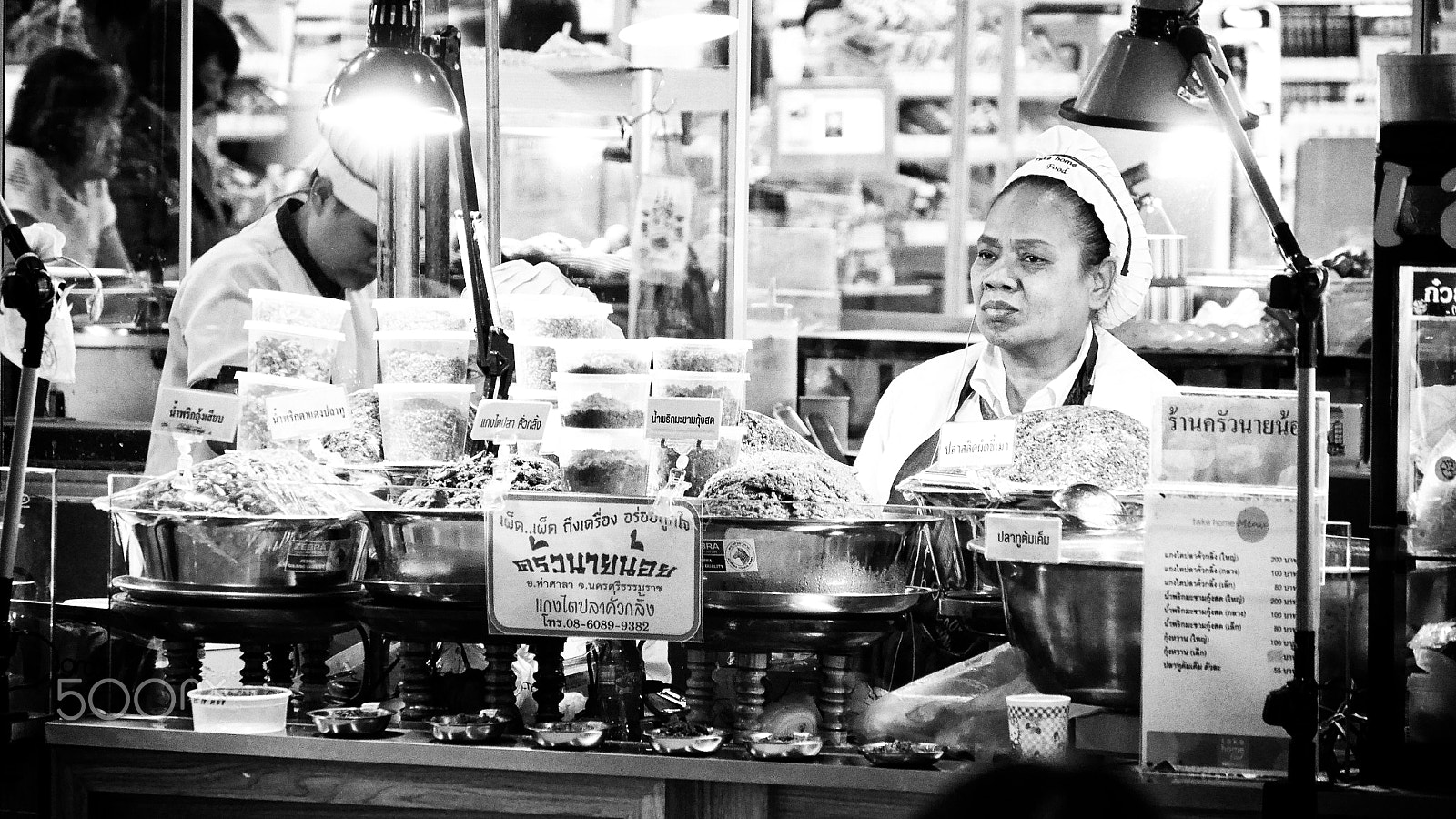 Panasonic Lumix DMC-GF7 sample photo. Woman selling food photography