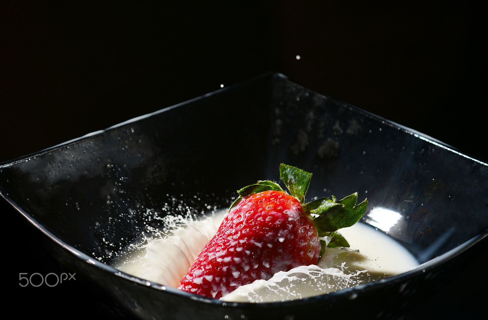 Nikon D810 + Nikon AF Nikkor 105mm F2D DC sample photo. Ripe strawberry falling in a milk with splash photography