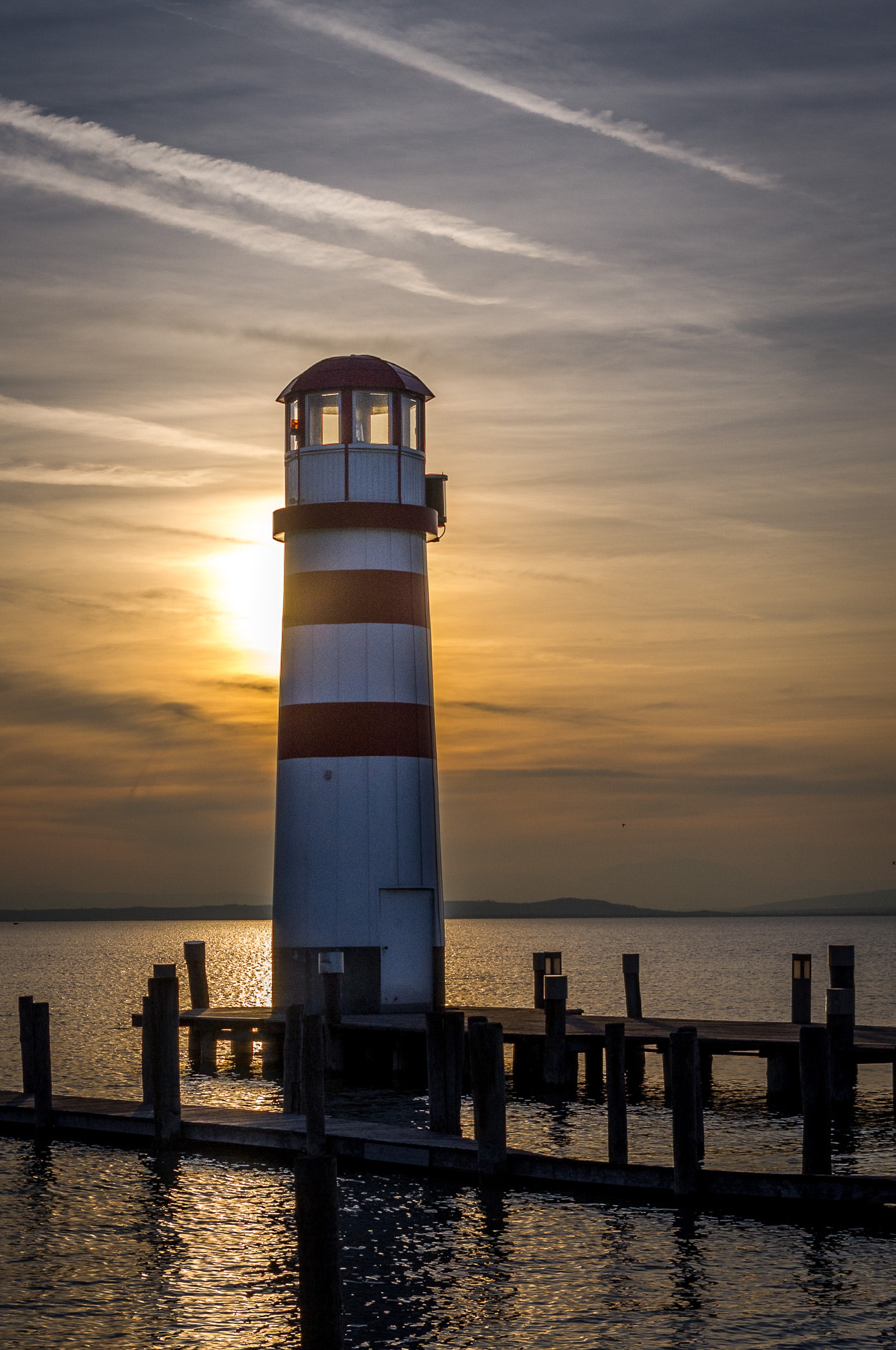 Pentax K-x sample photo. Lighthouse by sunset photography