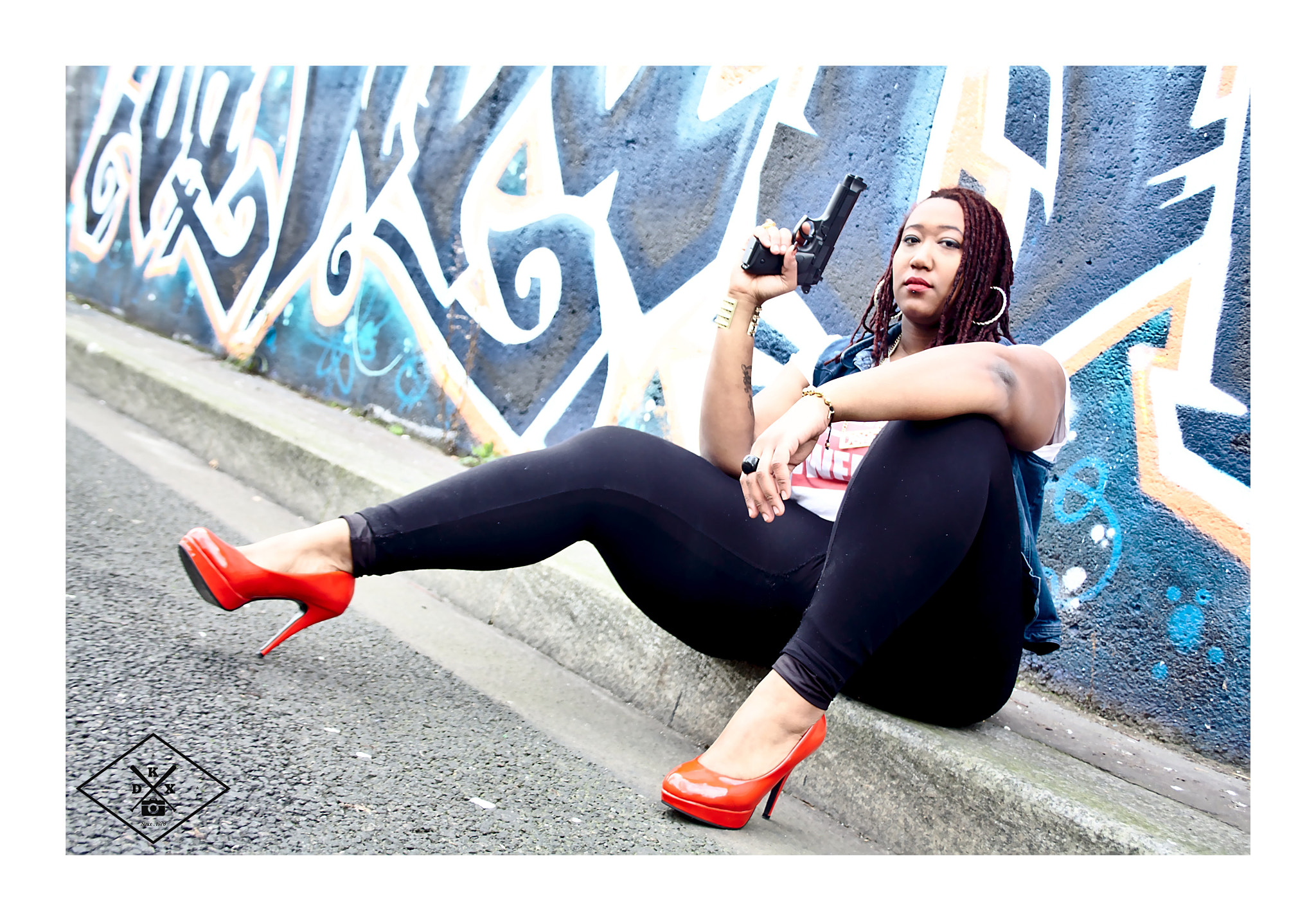 Canon EF-S 18-55mm F3.5-5.6 sample photo. Shooting hold up wear by dkx photography
