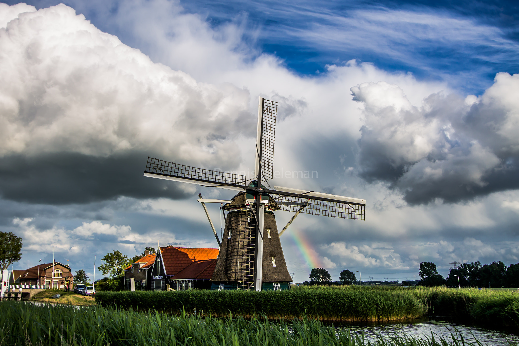 Canon EOS 1100D (EOS Rebel T3 / EOS Kiss X50) + Canon EF-S 10-22mm F3.5-4.5 USM sample photo. Classic windmill in some typical dutch weather photography