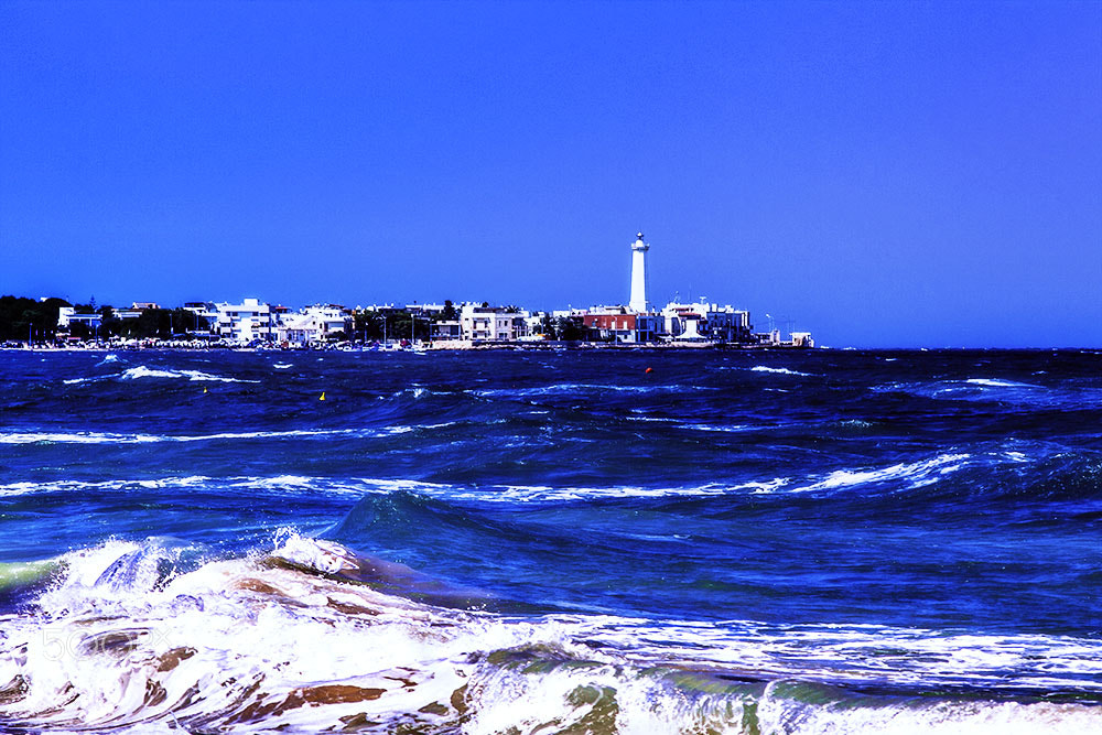 Canon EOS 50D + Canon EF 70-210mm f/4 sample photo. Faro con mare in burrasca - torre canne photography