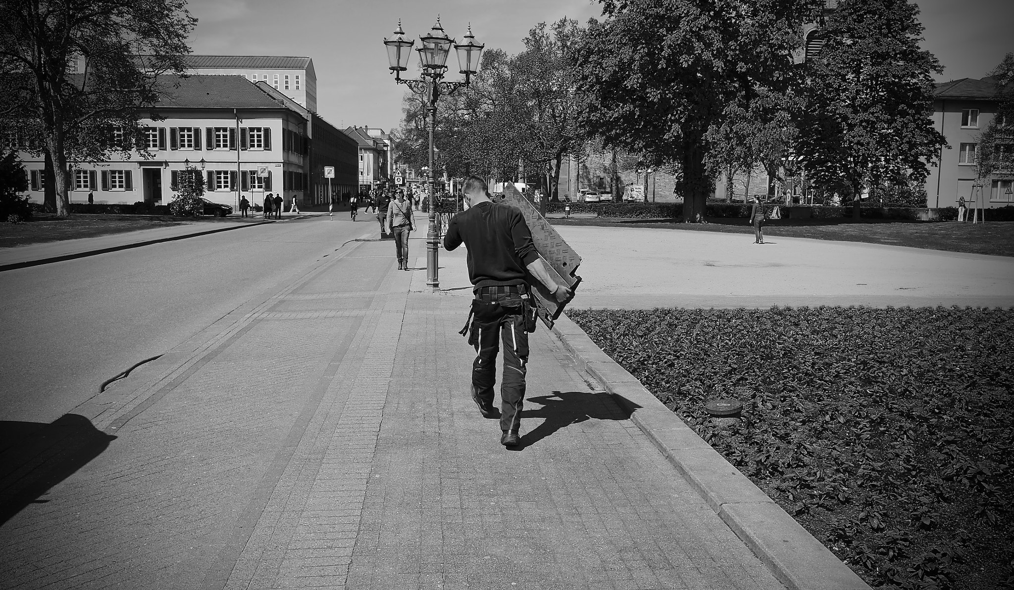 Olympus OM-D E-M10 + Panasonic Lumix G 14mm F2.5 ASPH sample photo. Man at work photography
