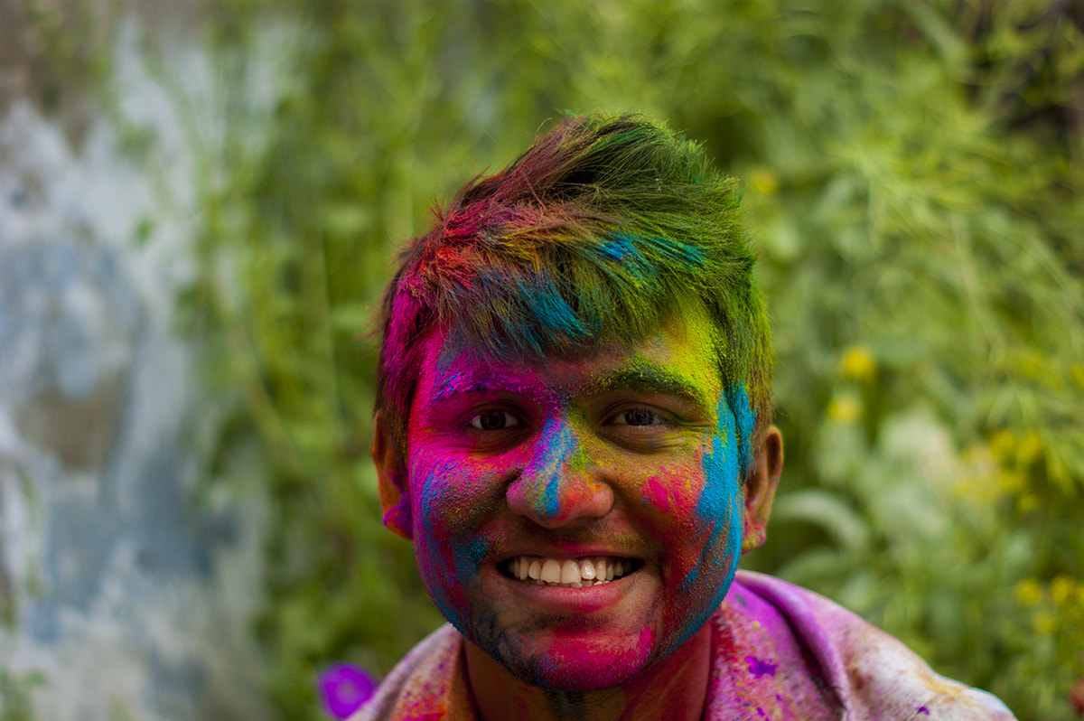 Sony Alpha DSLR-A390 + Sony DT 50mm F1.8 SAM sample photo. Portrait of man with holi paint photography