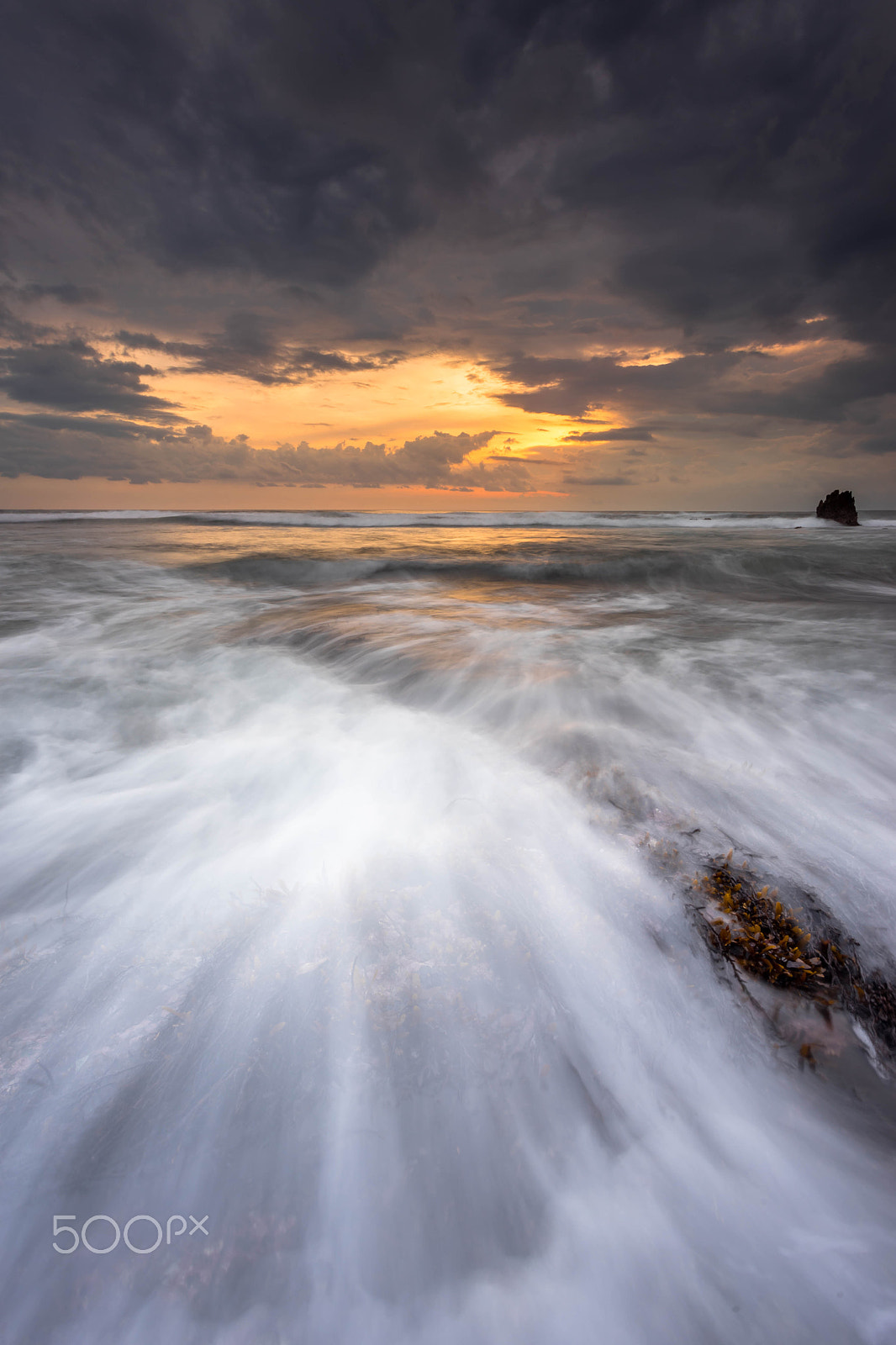 Sony a7 + Canon EF 17-40mm F4L USM sample photo. Stormy sunset at melasti beach, bali indonesia photography