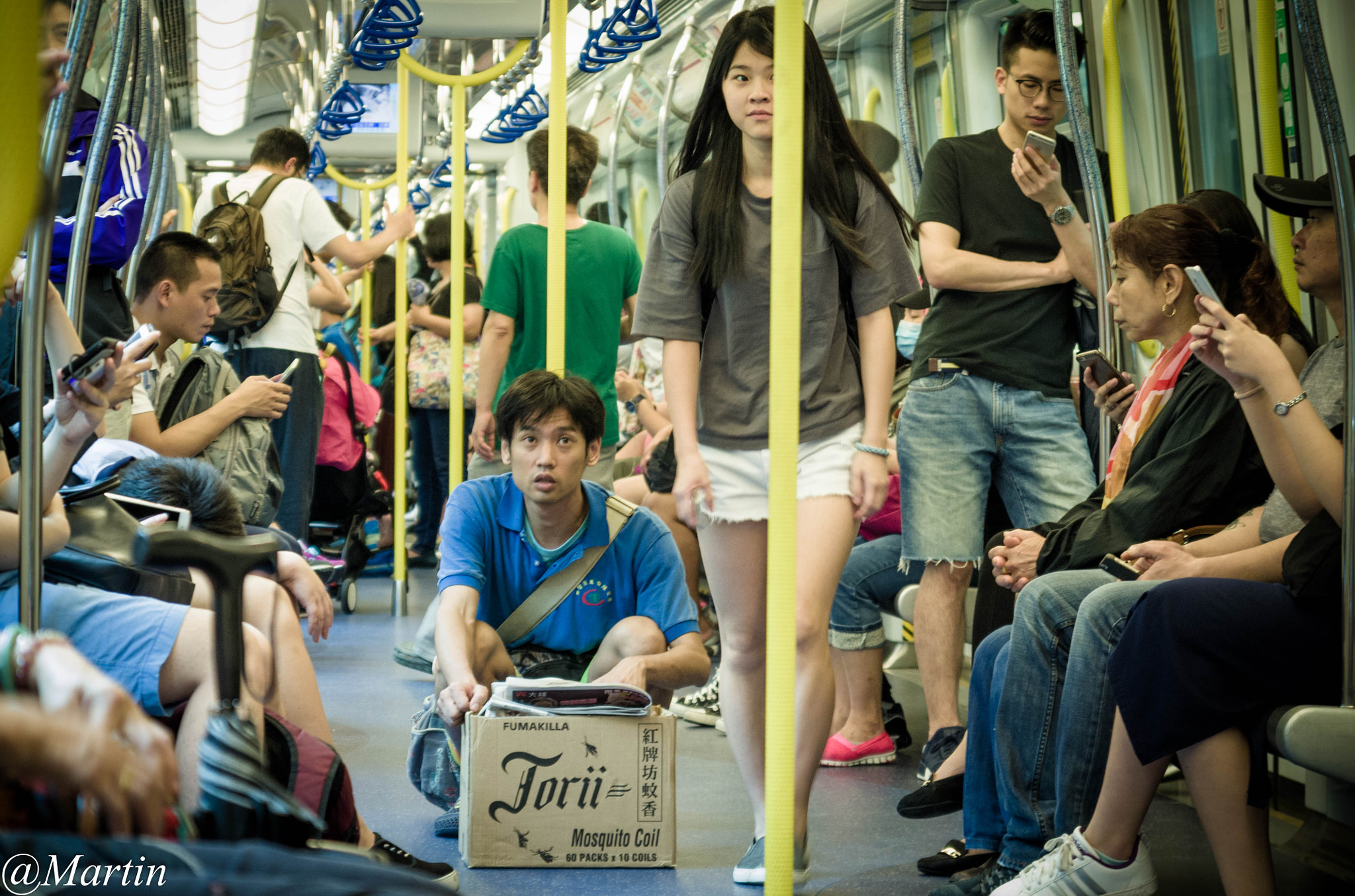 Sigma 17-70mm F2.8-4 DC Macro OS HSM sample photo. People in subway photography