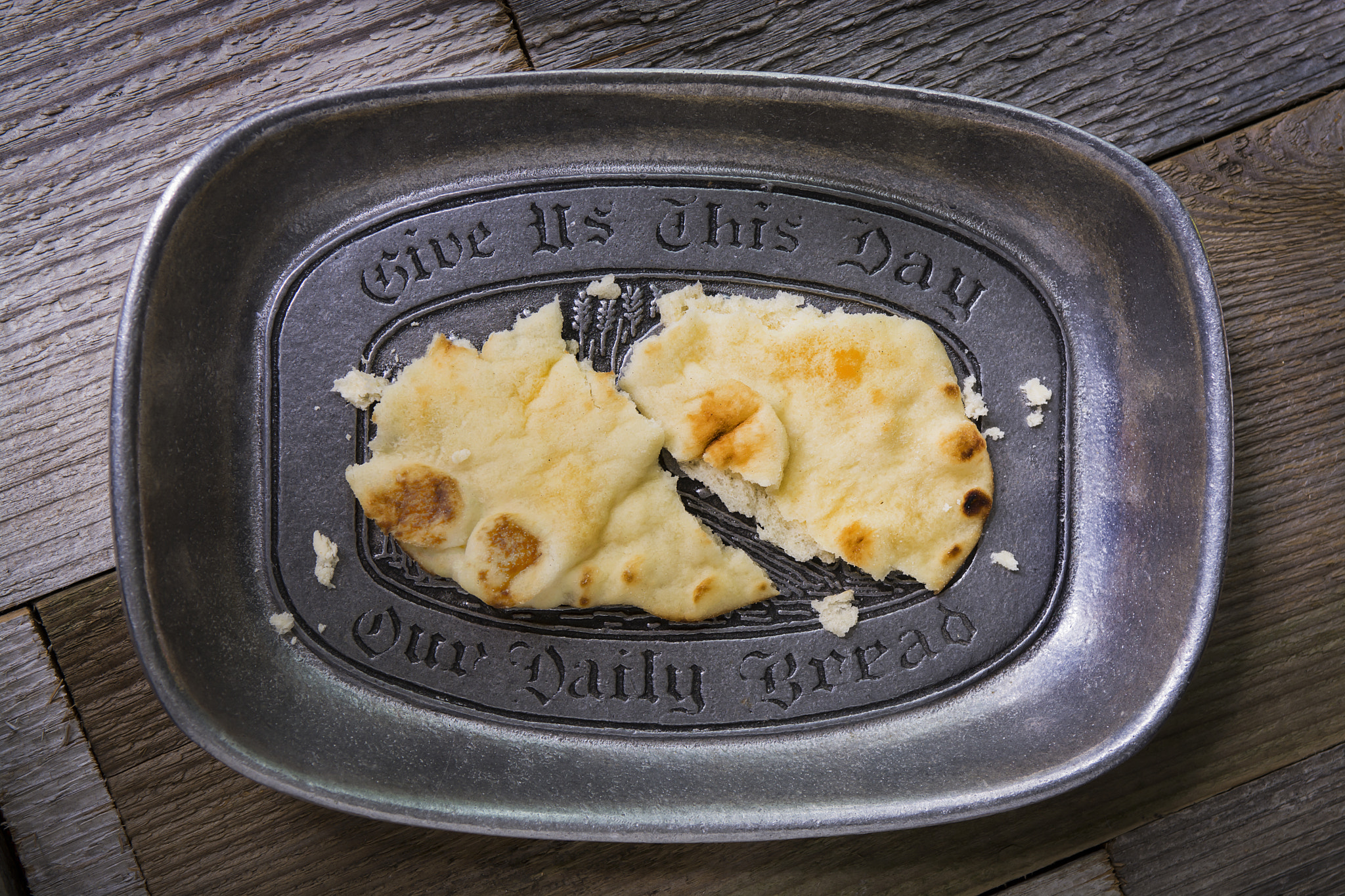 Nikon AF-S Nikkor 28-70mm F2.8 ED-IF sample photo. Bread on a puter prayer plate and old wood surface photography