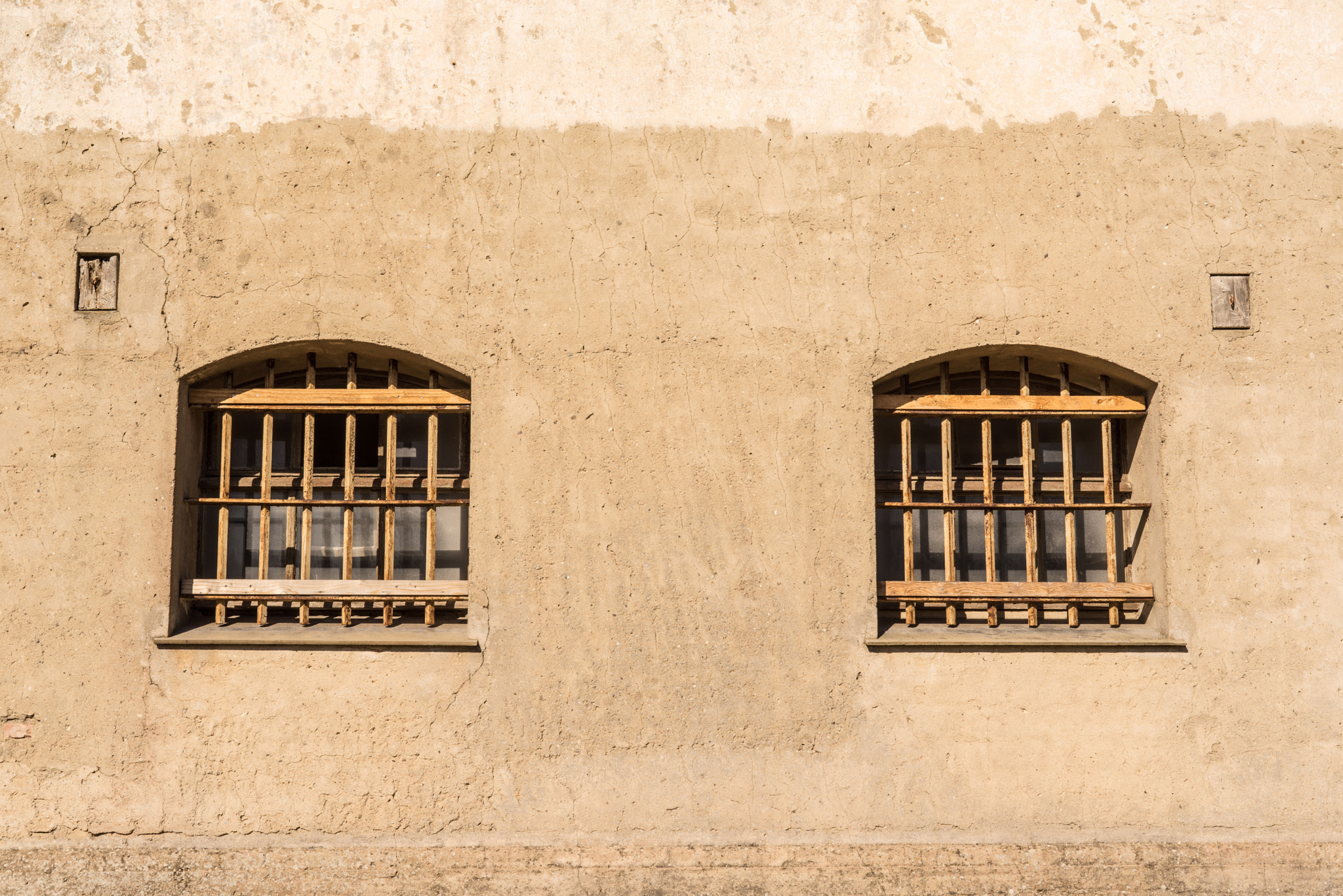Sony a7R + Sony 50mm F1.4 sample photo. Prison with bars on the windows photography