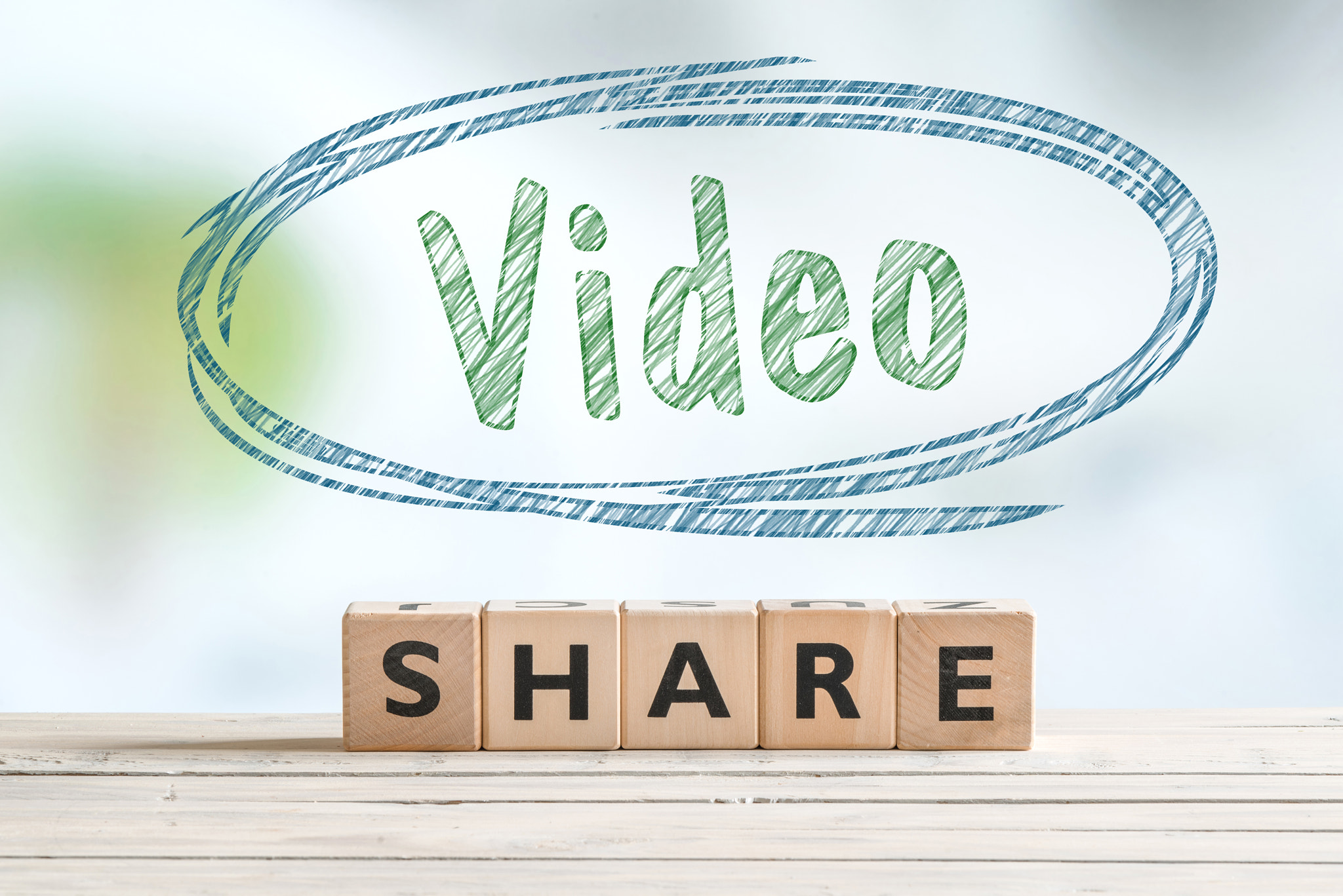 Share video sign on a table