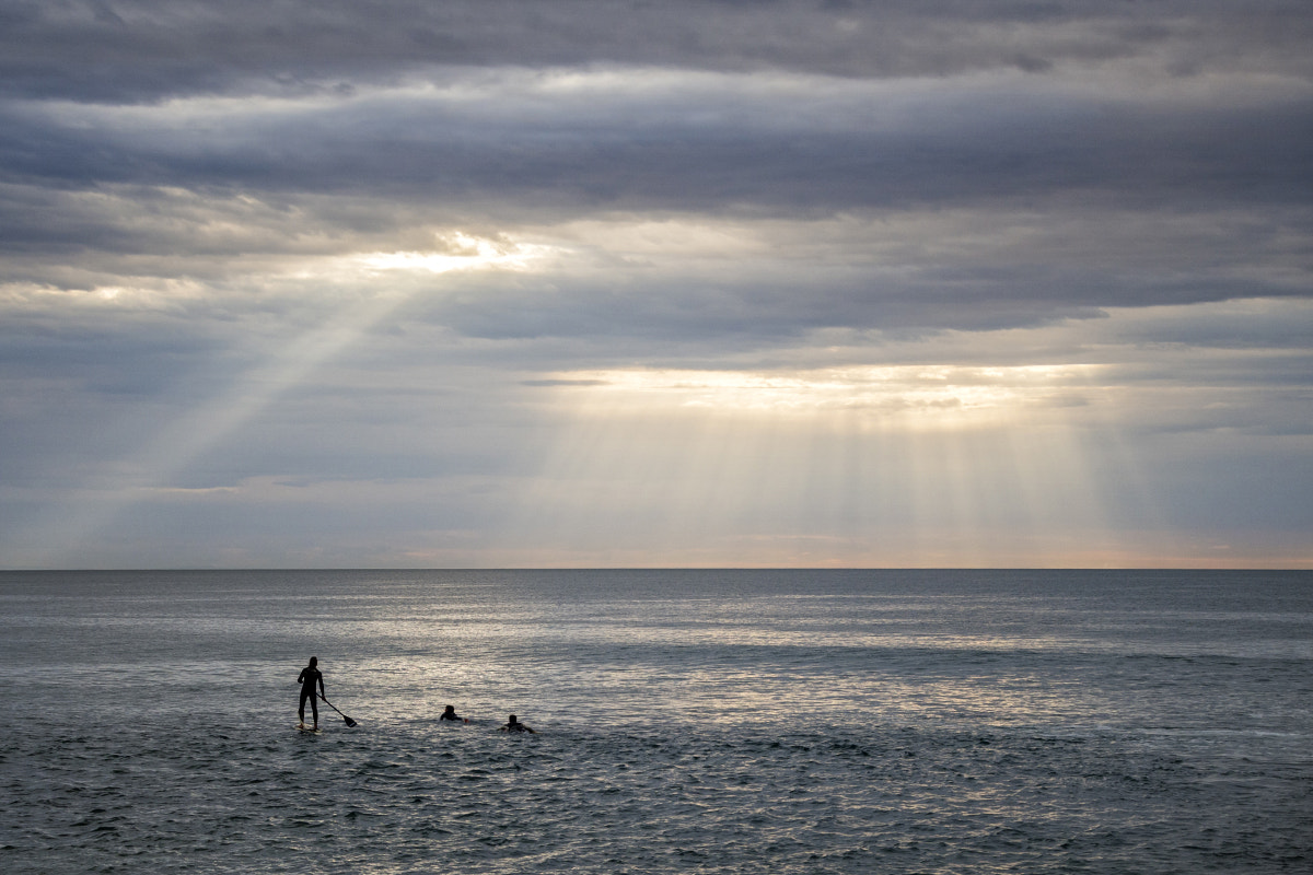 Olympus OM-D E-M10 + Tamron 14-150mm F3.5-5.8 Di III sample photo. Sunset with surfers photography