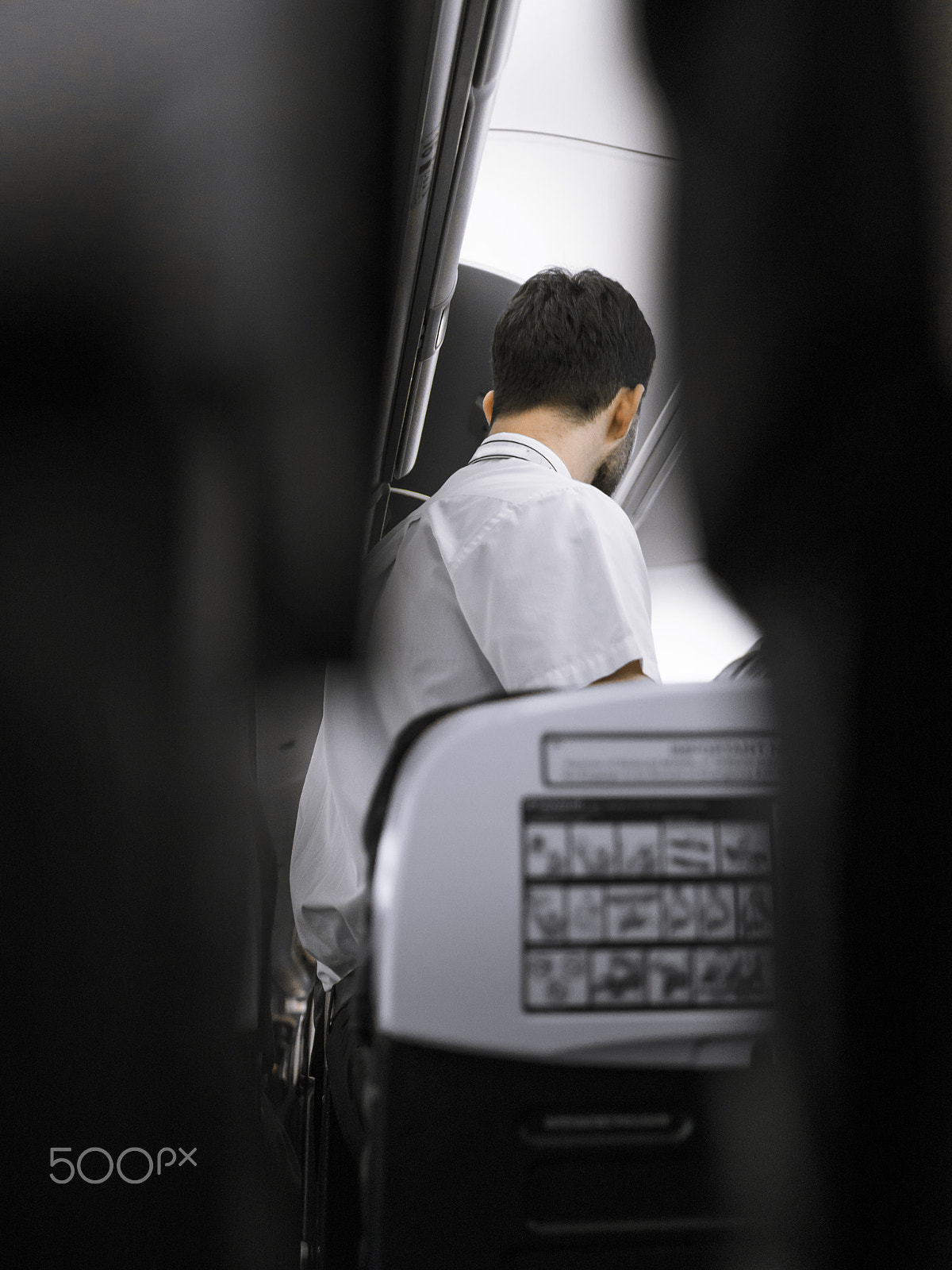 Panasonic Lumix DMC-GH3 + LUMIX G 25/F1.7 sample photo. Flight attendant from airplane seats photography