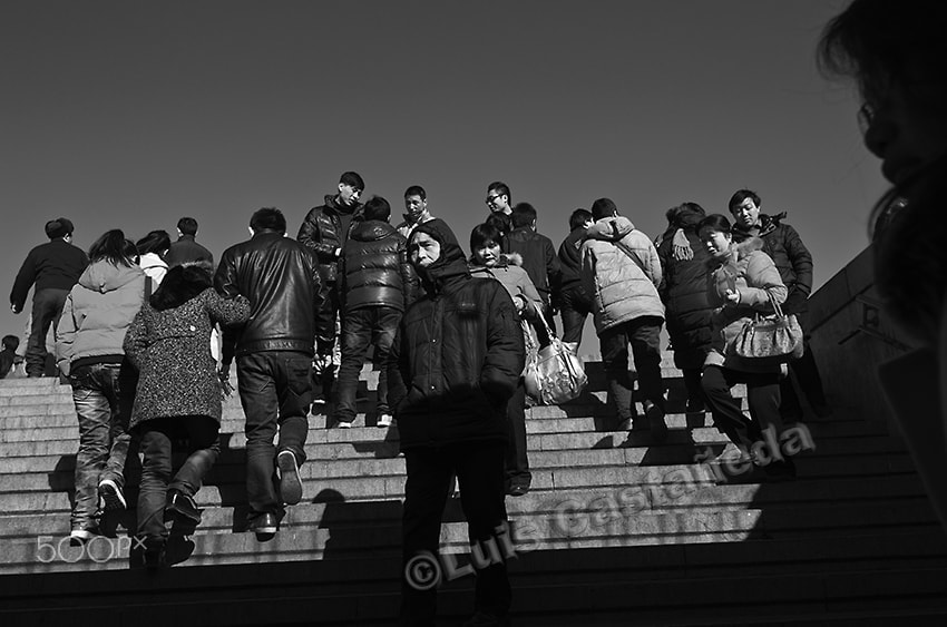 Pentax smc DA 21mm F3.2 AL Limited sample photo. People at tiananmen subway entrance. photography