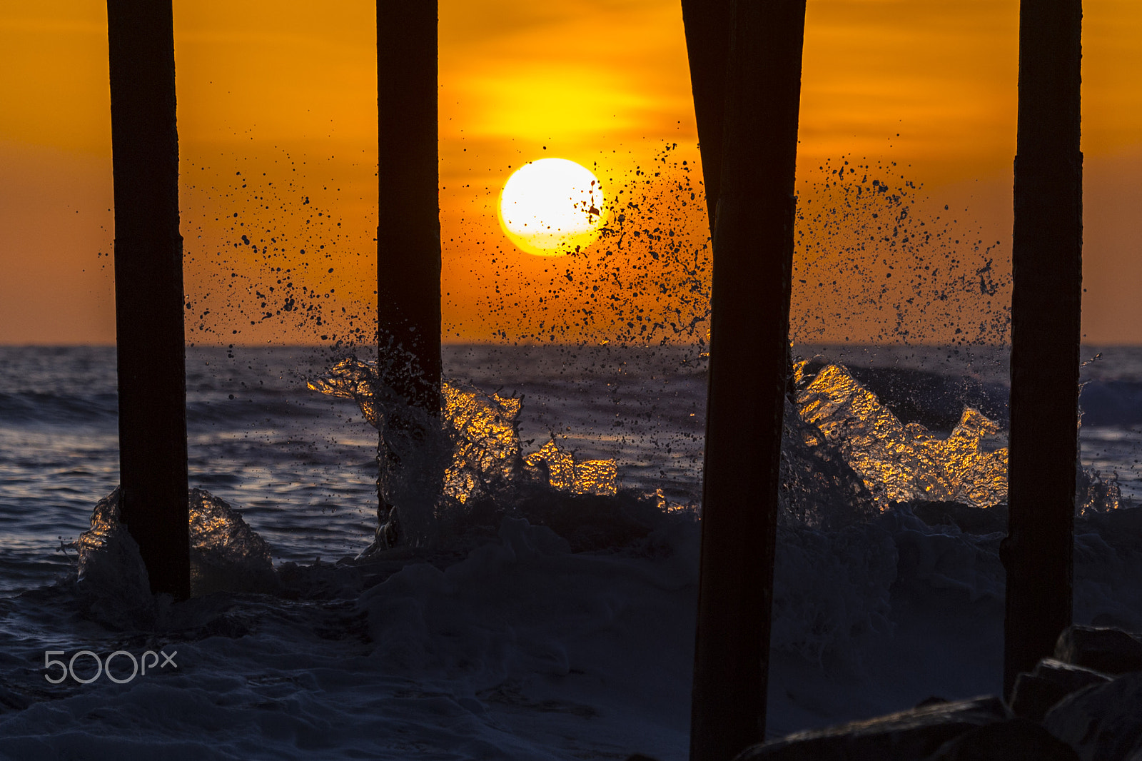 Nikon D3S sample photo. Waves crash on the oceanside pier at sunset photography