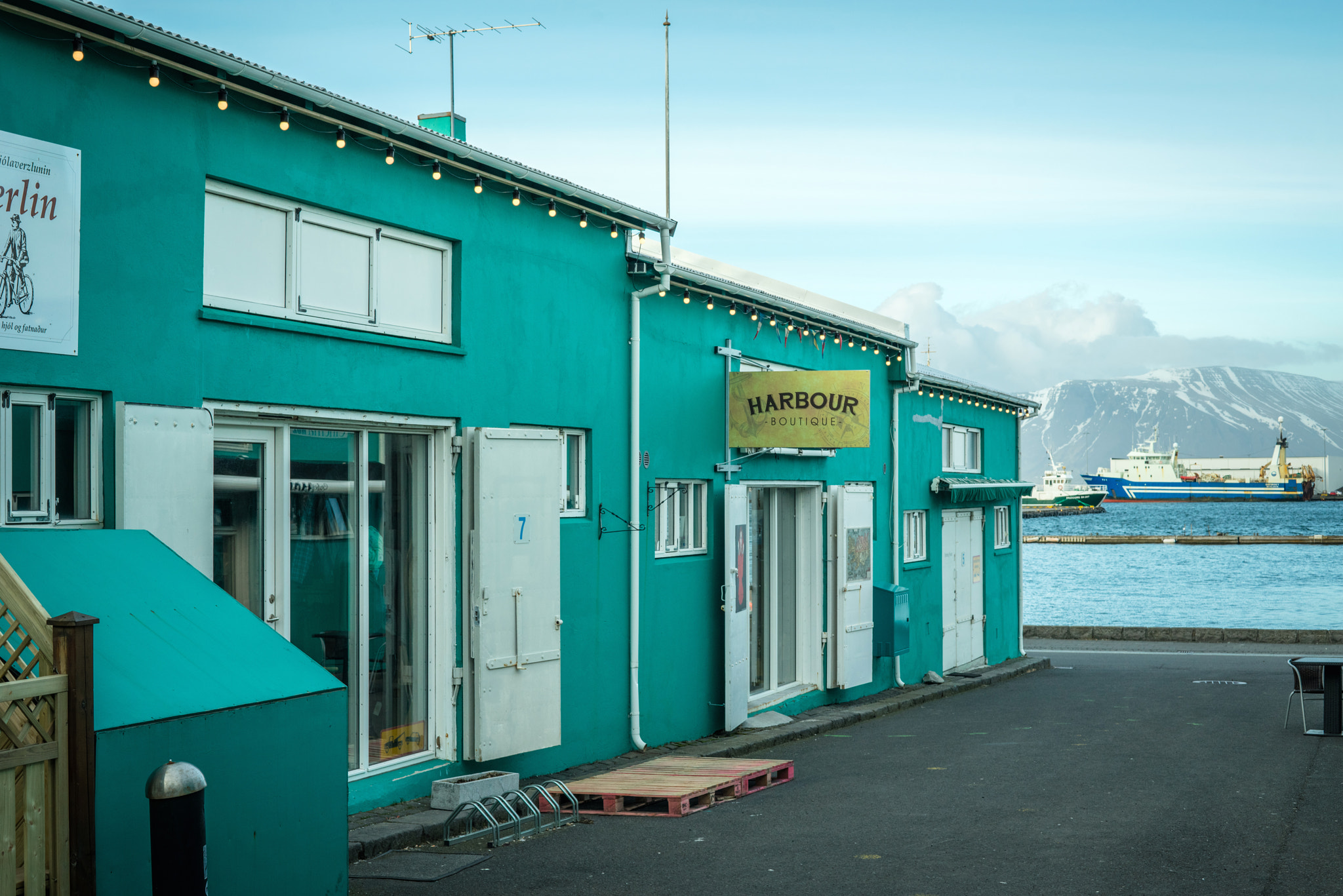 Sony a7R + Sony 50mm F1.4 sample photo. Shops in green color by the harbor in reykjavik photography
