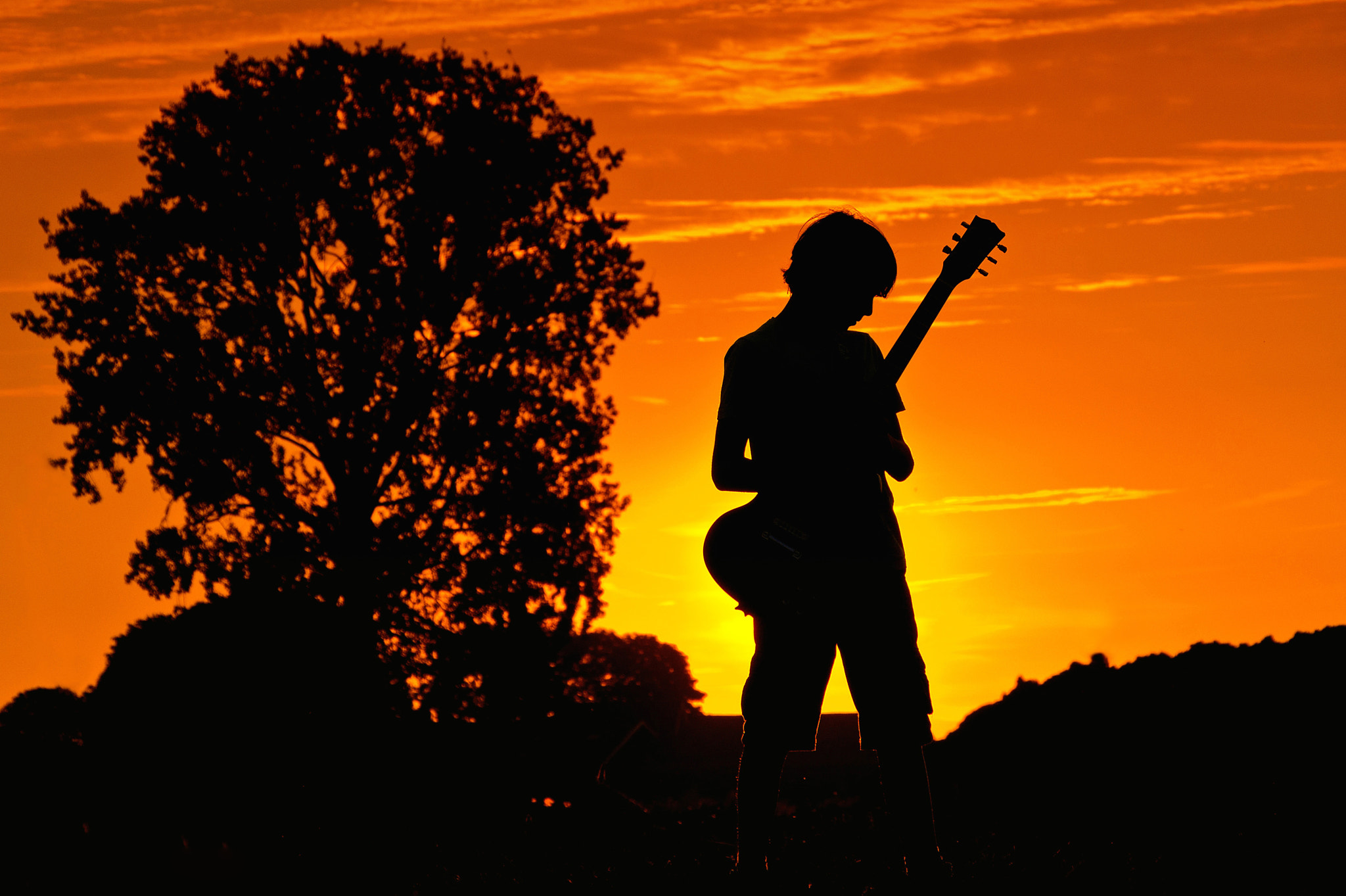 Sony Alpha DSLR-A580 sample photo. The young guitarist photography