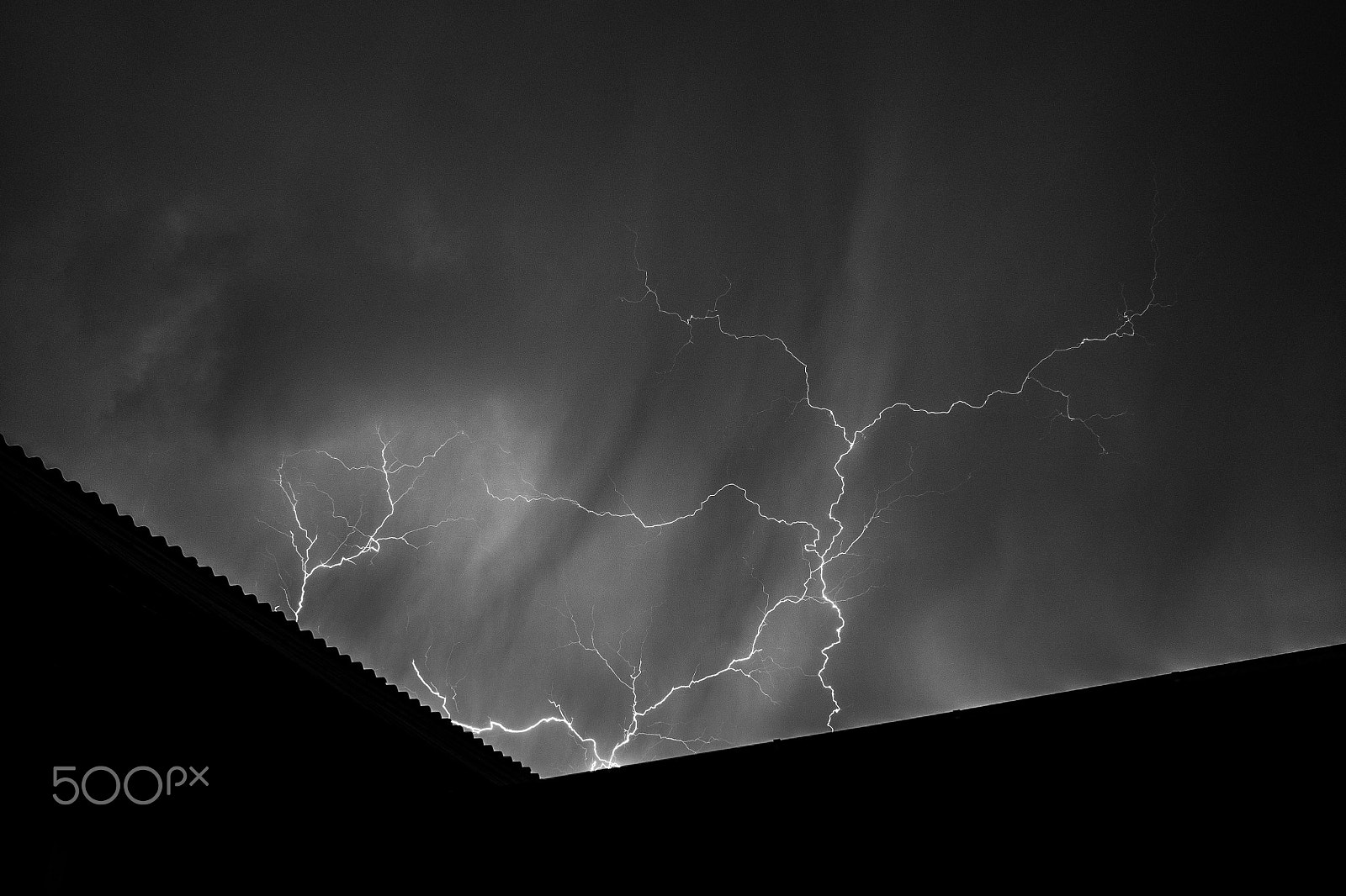 Olympus OM-D E-M10 + Olympus M.Zuiko Digital 17mm F1.8 sample photo. Lightning over a a house photography