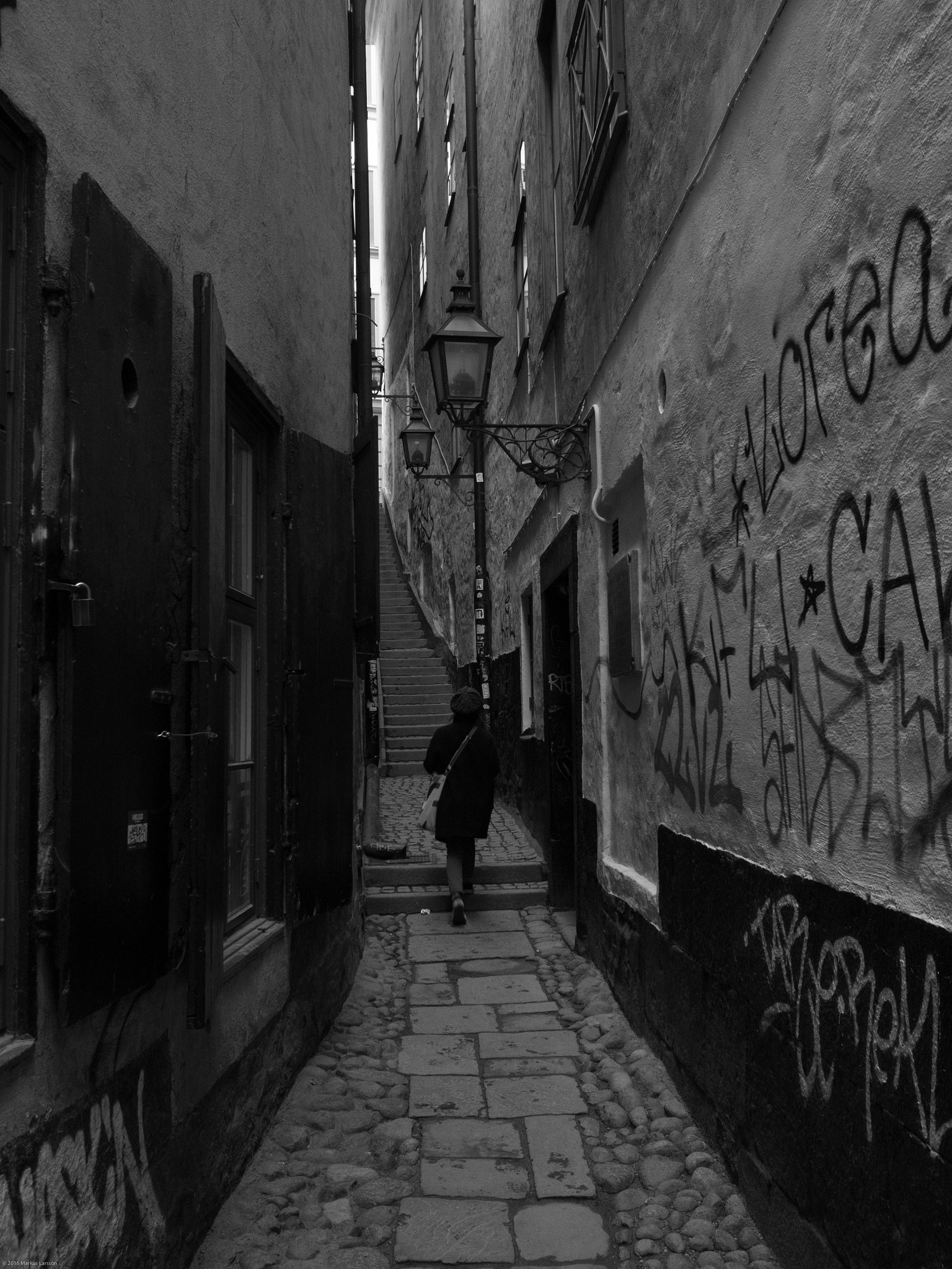 Olympus M.Zuiko Digital 17mm F1.8 sample photo. Girl walking up stairs in narrow walkway photography