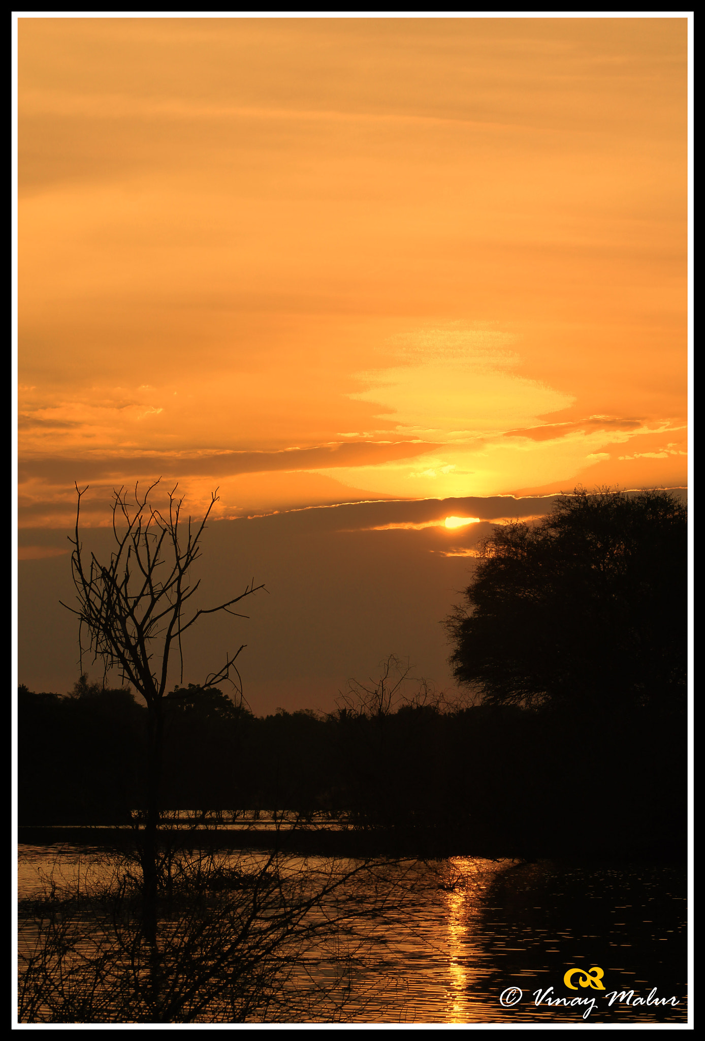 Canon EF 75-300mm f/4-5.6 USM sample photo. Sunset over a lake photography