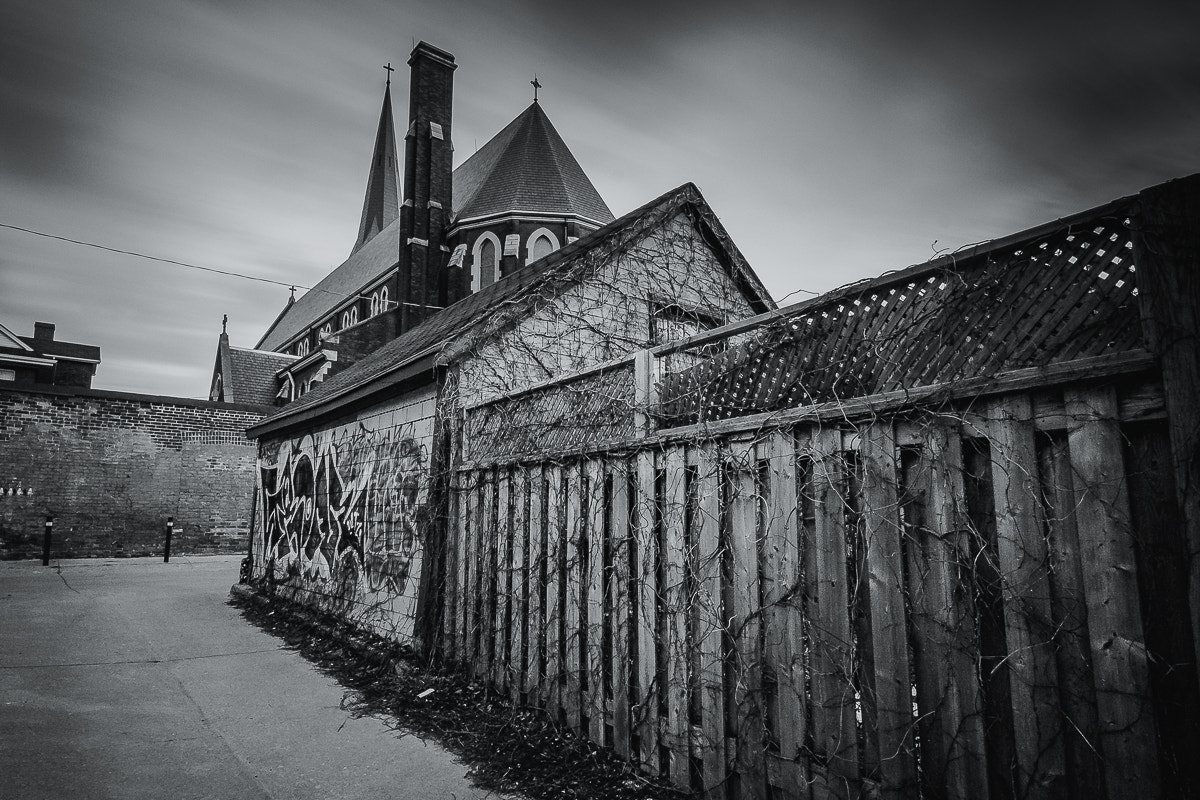 ZEISS Touit 12mm F2.8 sample photo. Alleyway church photography