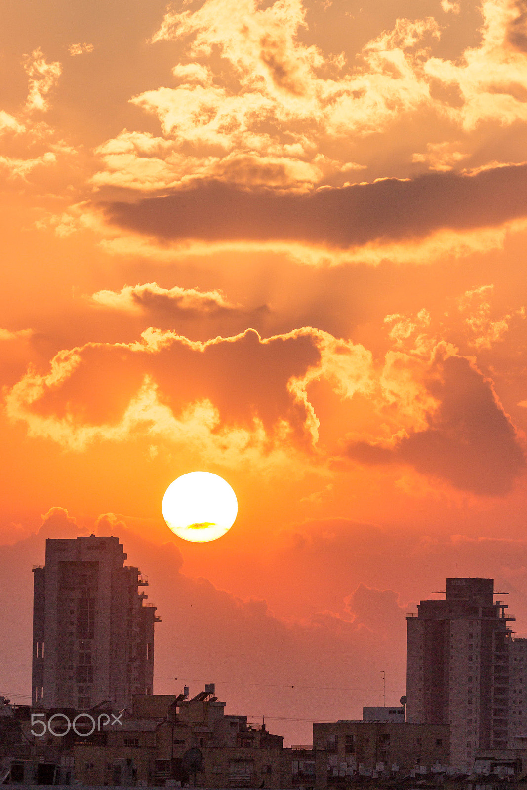 Canon EOS 600D (Rebel EOS T3i / EOS Kiss X5) sample photo. Two buildings, few clouds and one sun-set photography
