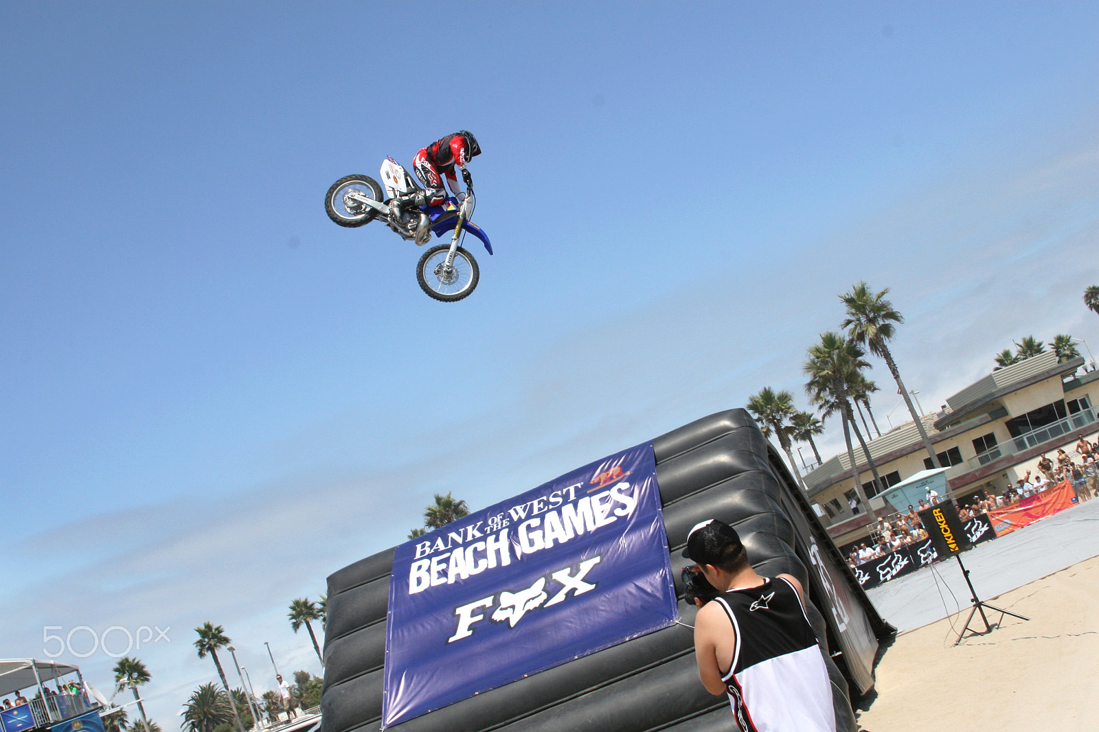 Canon EOS 30D + Canon EF 28-135mm F3.5-5.6 IS USM sample photo. Flying high - beach motorcross photography