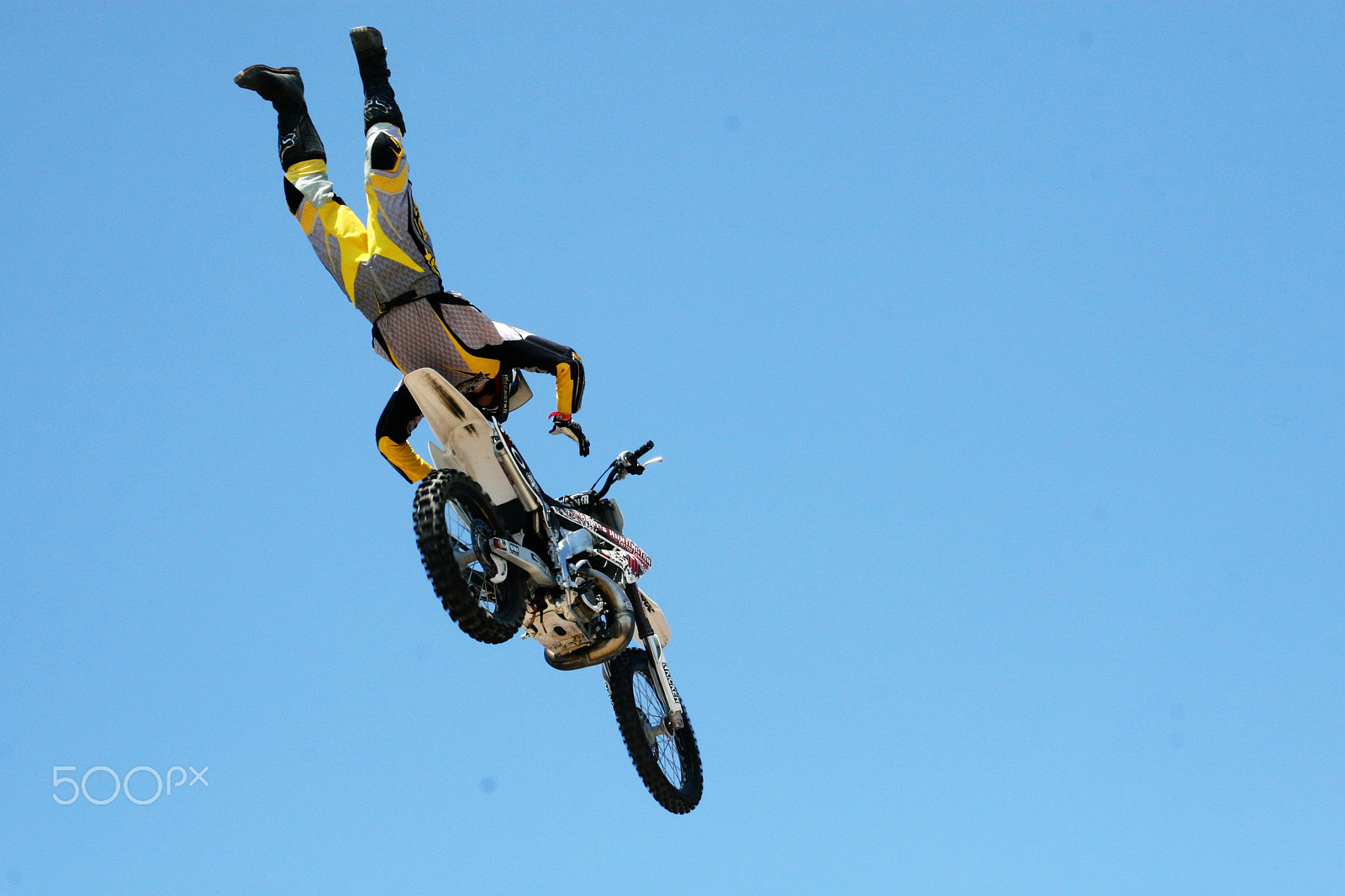 Canon EOS 30D + Canon EF 28-135mm F3.5-5.6 IS USM sample photo. Flying high - beach motorcross photography