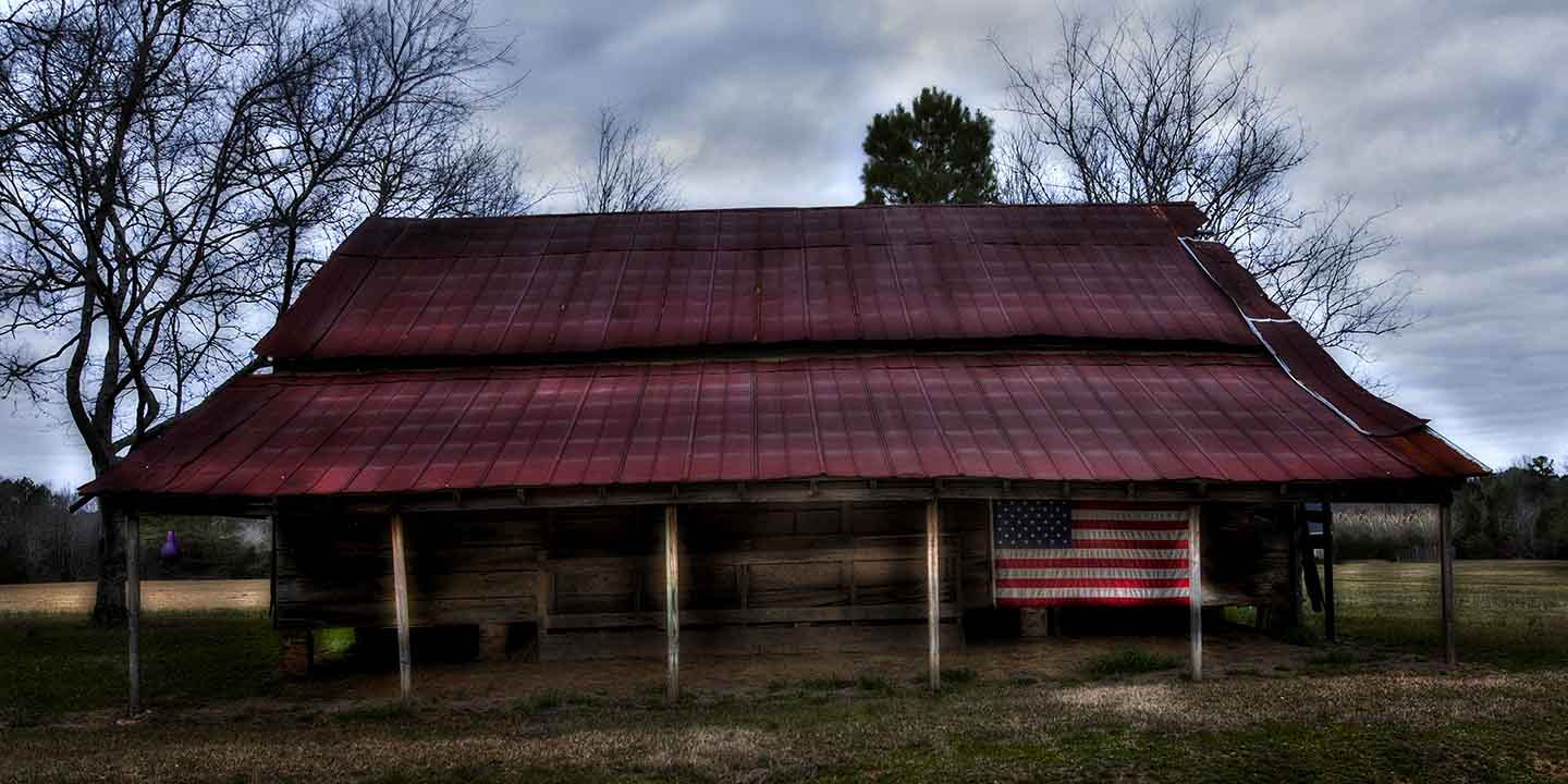 Canon EOS 5D + Canon EF 16-35mm F2.8L USM sample photo. Barn with flag photography