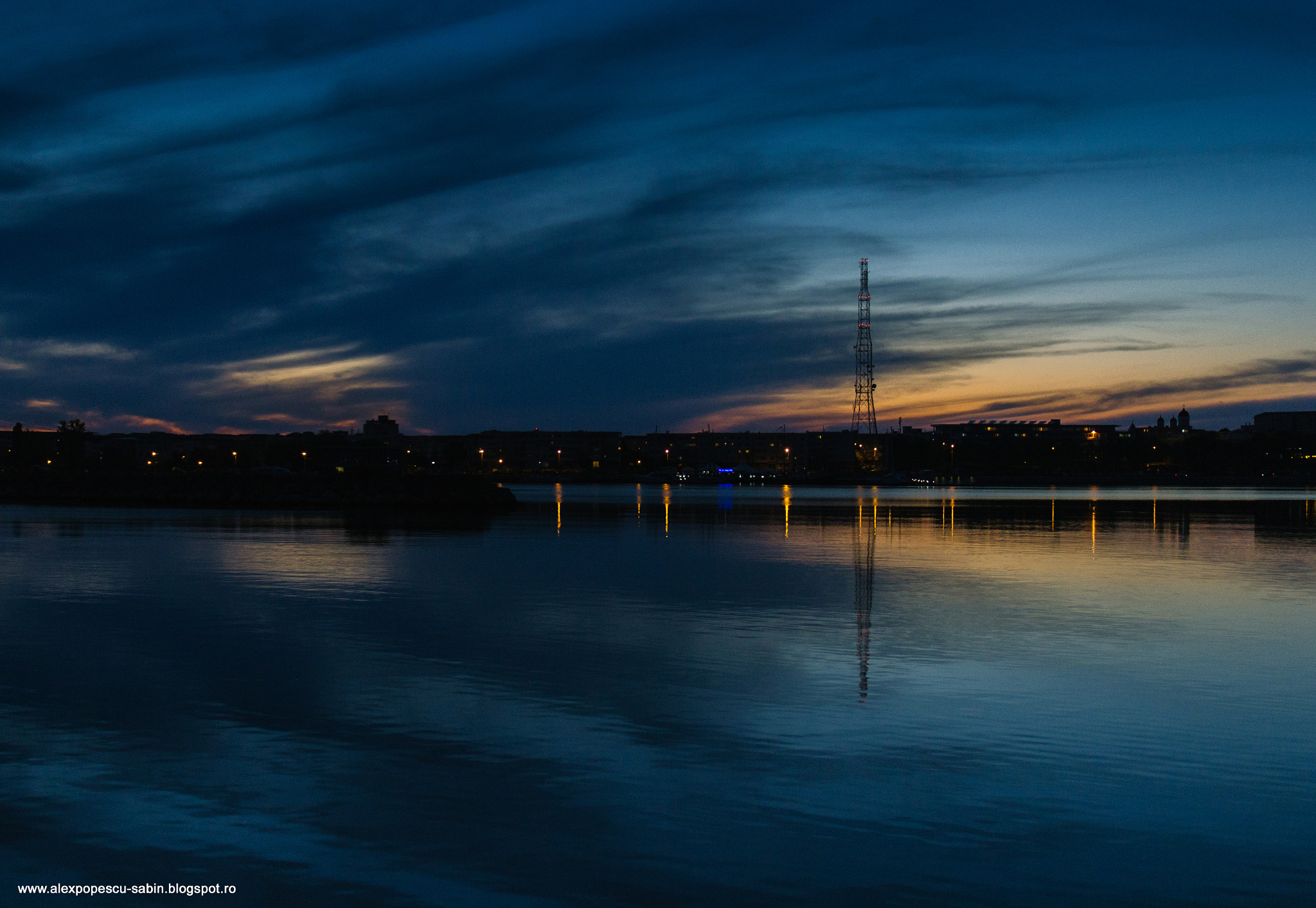 Sigma 17-70mm F2.8-4 DC Macro OS HSM sample photo. Red lights in the middle of a sunset photography