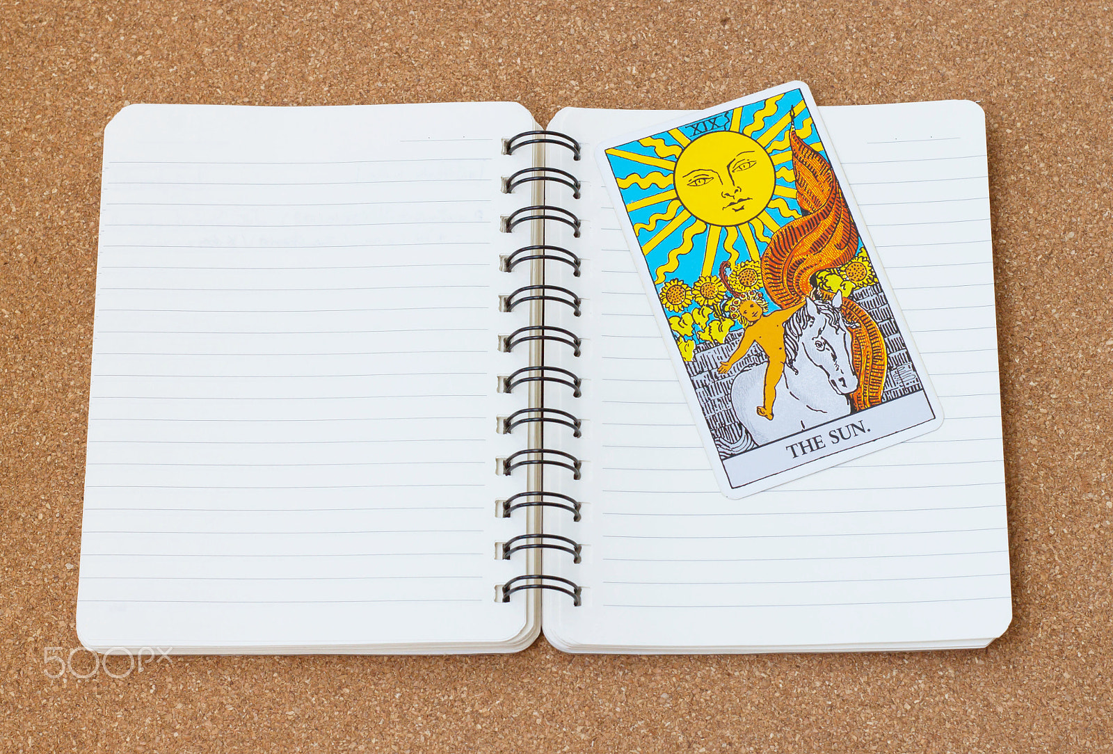 Canon EOS 500D (EOS Rebel T1i / EOS Kiss X3) + Canon EF 50mm F1.8 II sample photo. Tarot card "the sun" with notebook and space. photography