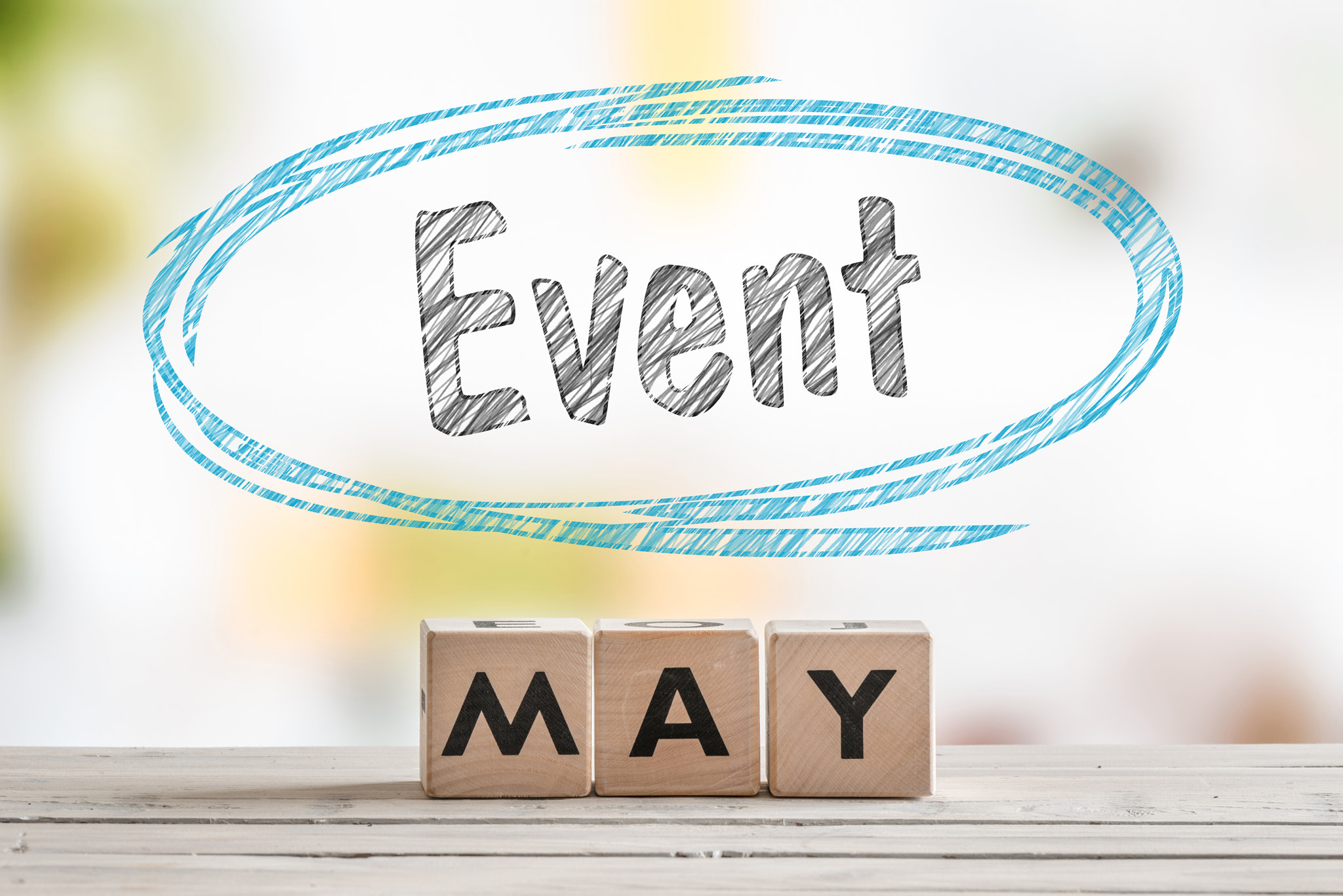 May event sign on a wooden table