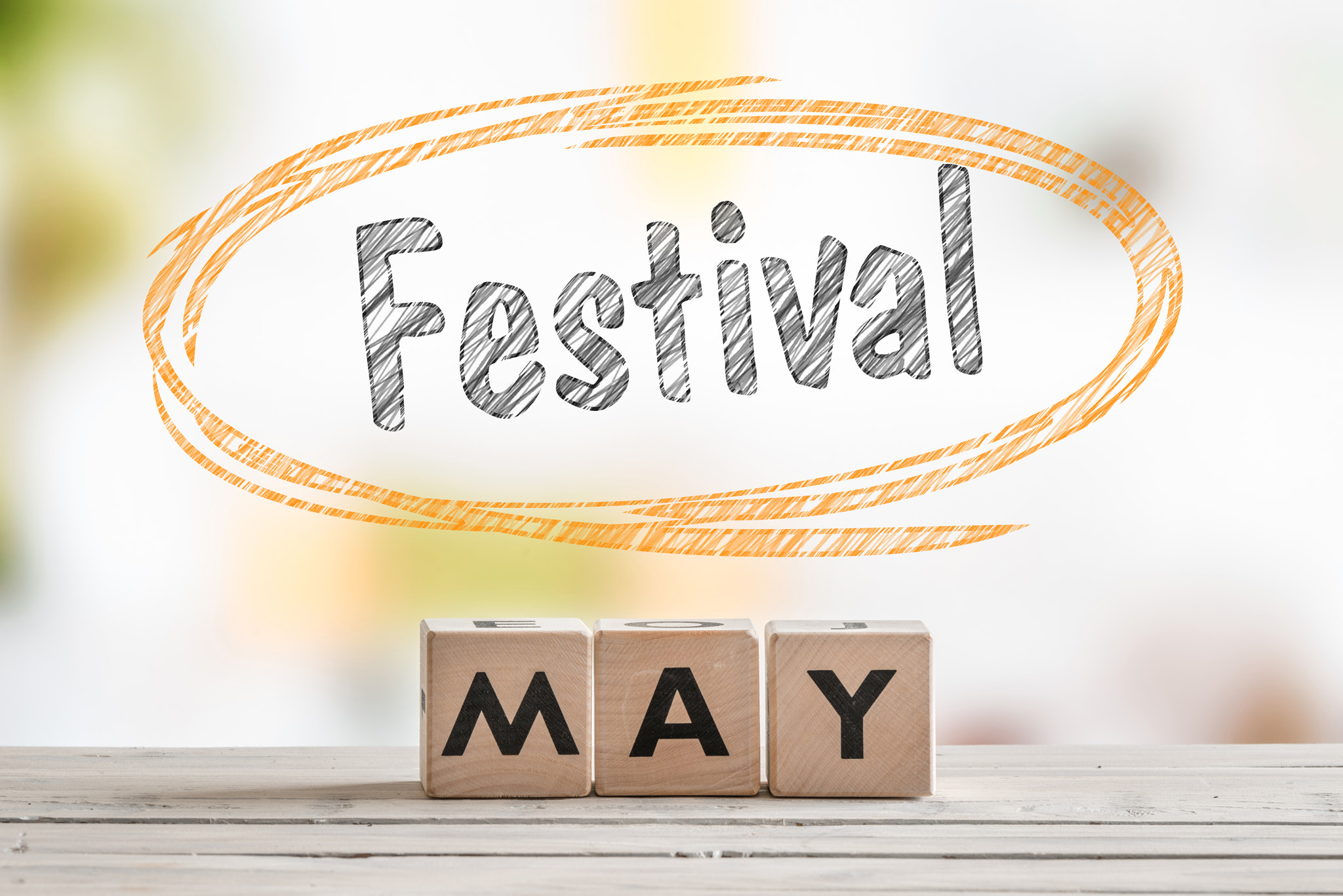 Sony 70-400mm F4-5.6 G SSM II sample photo. May festival sign on a wooden table photography