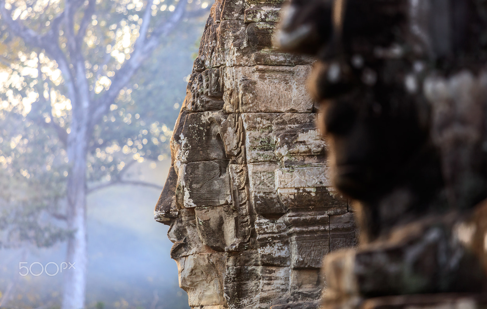 Canon EF 70-200mm F4L IS USM sample photo. Bayon faces in soft evening light photography