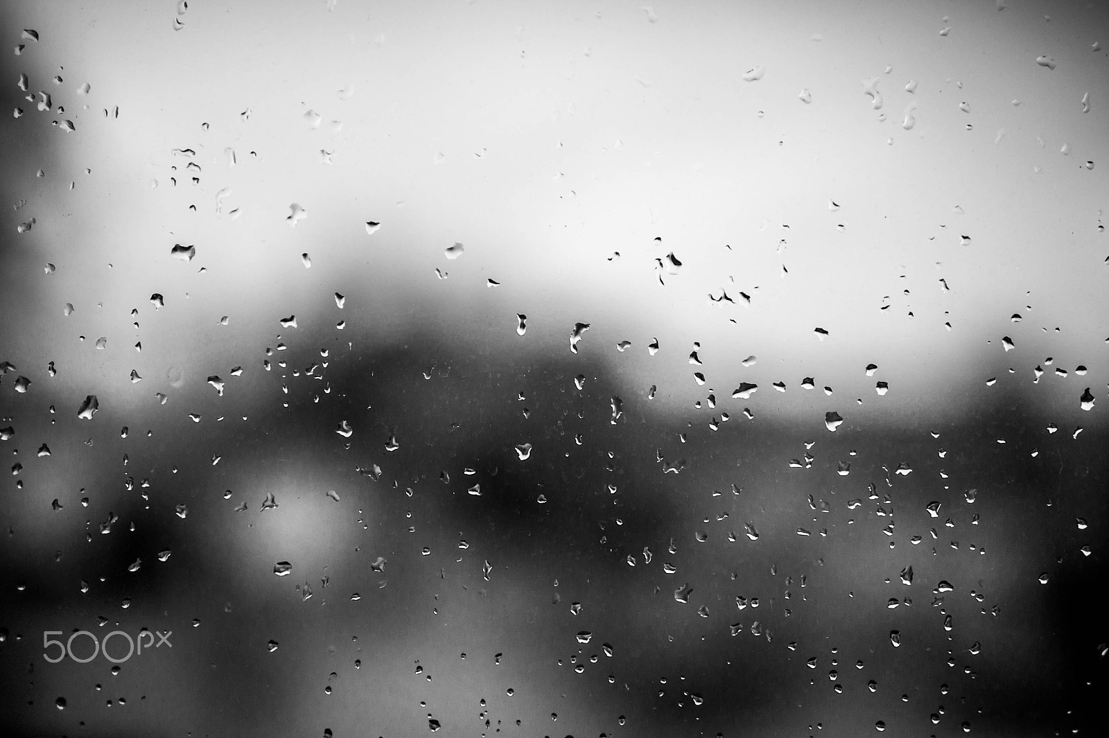 Sony Alpha NEX-5 + Sony E 35mm F1.8 OSS sample photo. Rain water drops on the windows glass photography