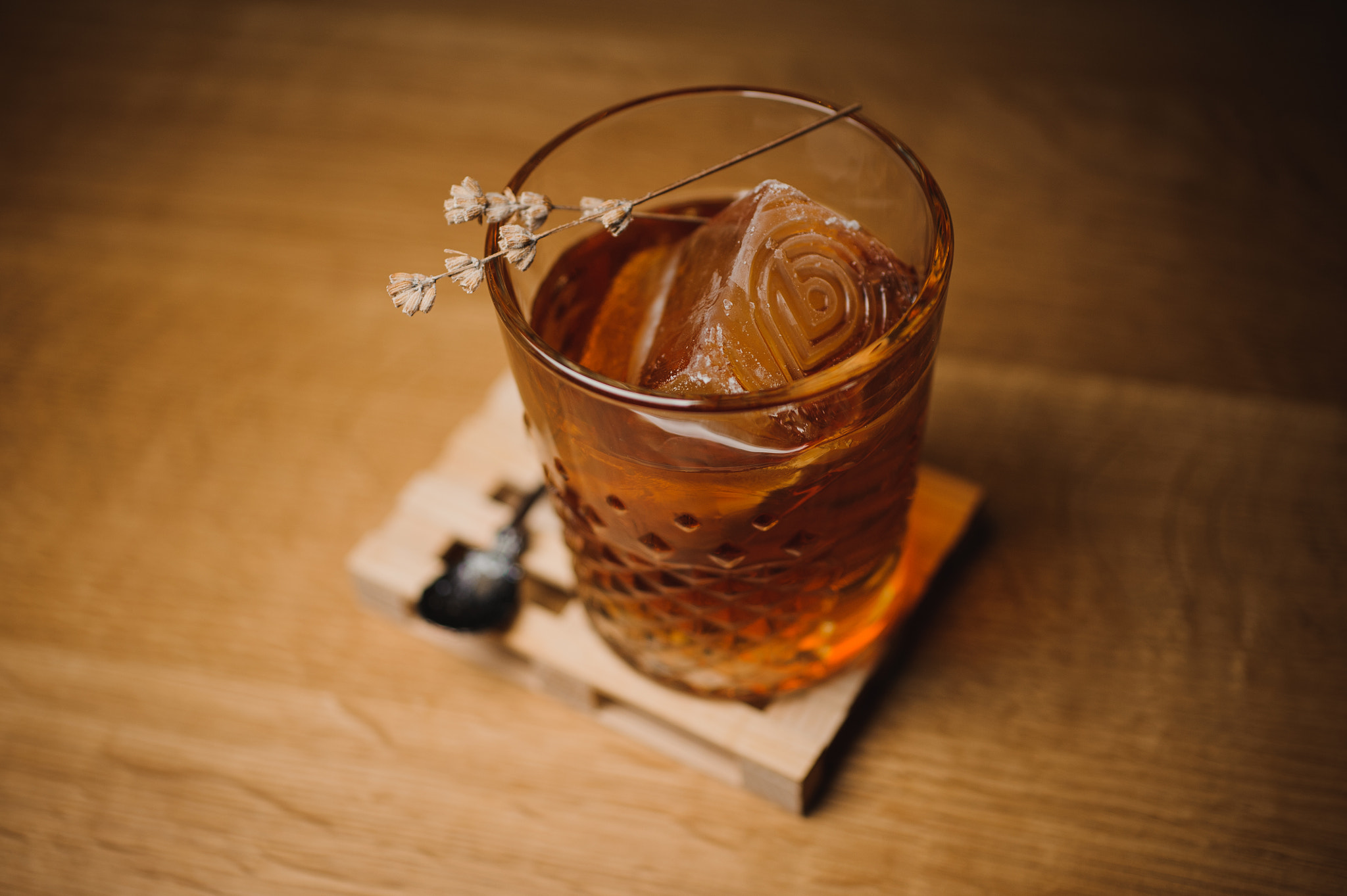 Nikon D700 + Sigma 50mm F2.8 EX DG Macro sample photo. Whiskey drink with  ice  on  wood in bar photography