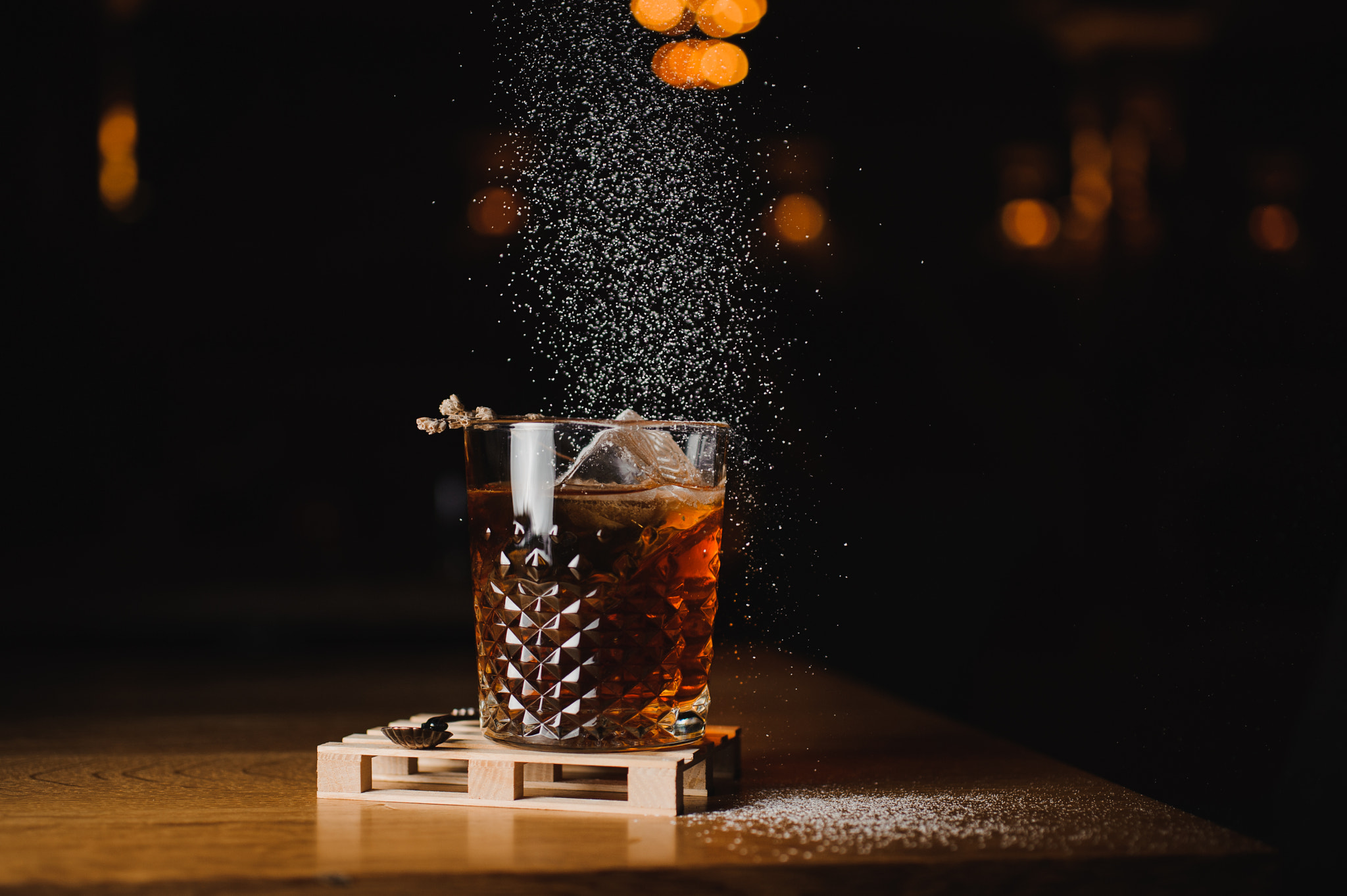 Nikon D700 + Sigma 50mm F2.8 EX DG Macro sample photo. Dusting whiskey drink with  ice  on  wood in bar photography