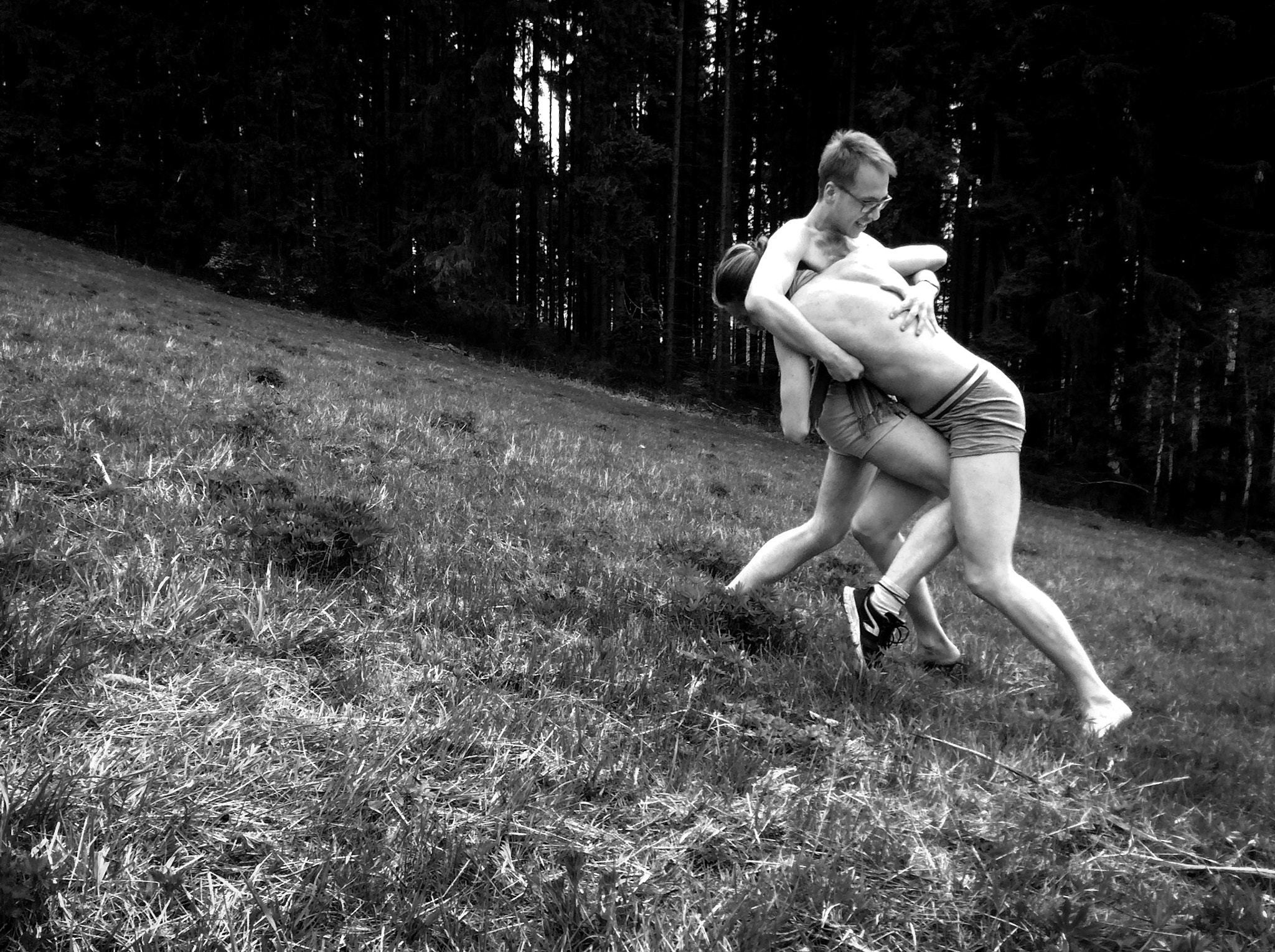 iPad Air back camera 3.3mm f/2.4 sample photo. Just random two people fighting with only underwear on in the forest photography
