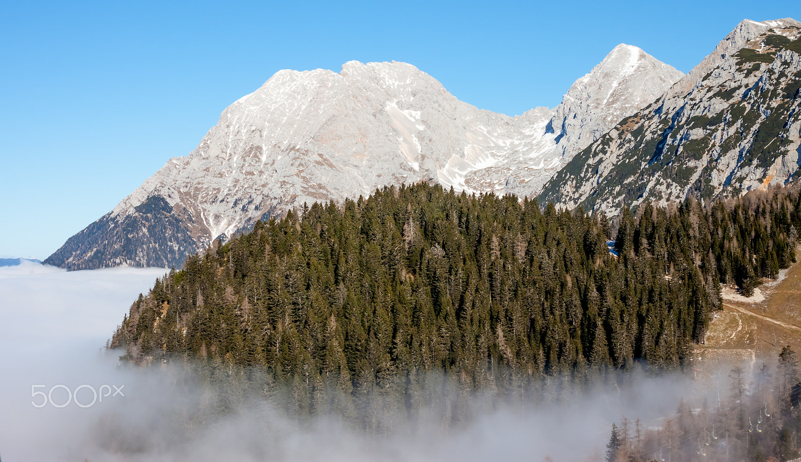 Canon EOS 500D (EOS Rebel T1i / EOS Kiss X3) + Canon EF 40mm F2.8 STM sample photo. View on mountains above clouds photography