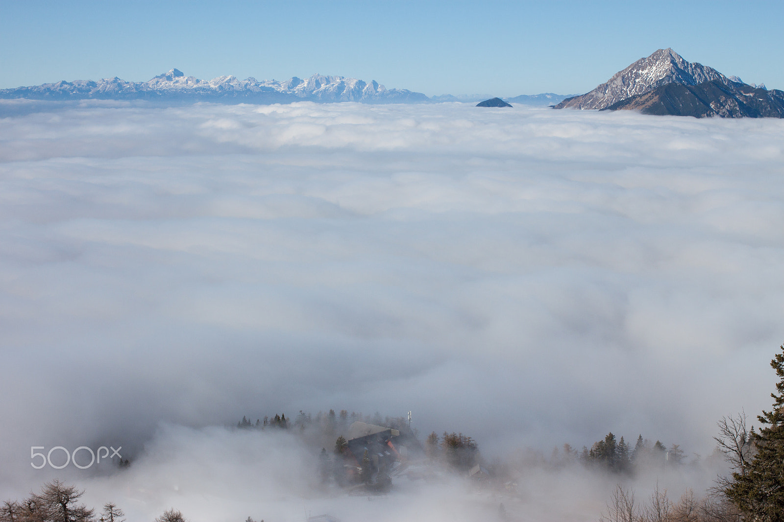 Canon EOS 500D (EOS Rebel T1i / EOS Kiss X3) + Canon EF 40mm F2.8 STM sample photo. View on mountains above clouds photography